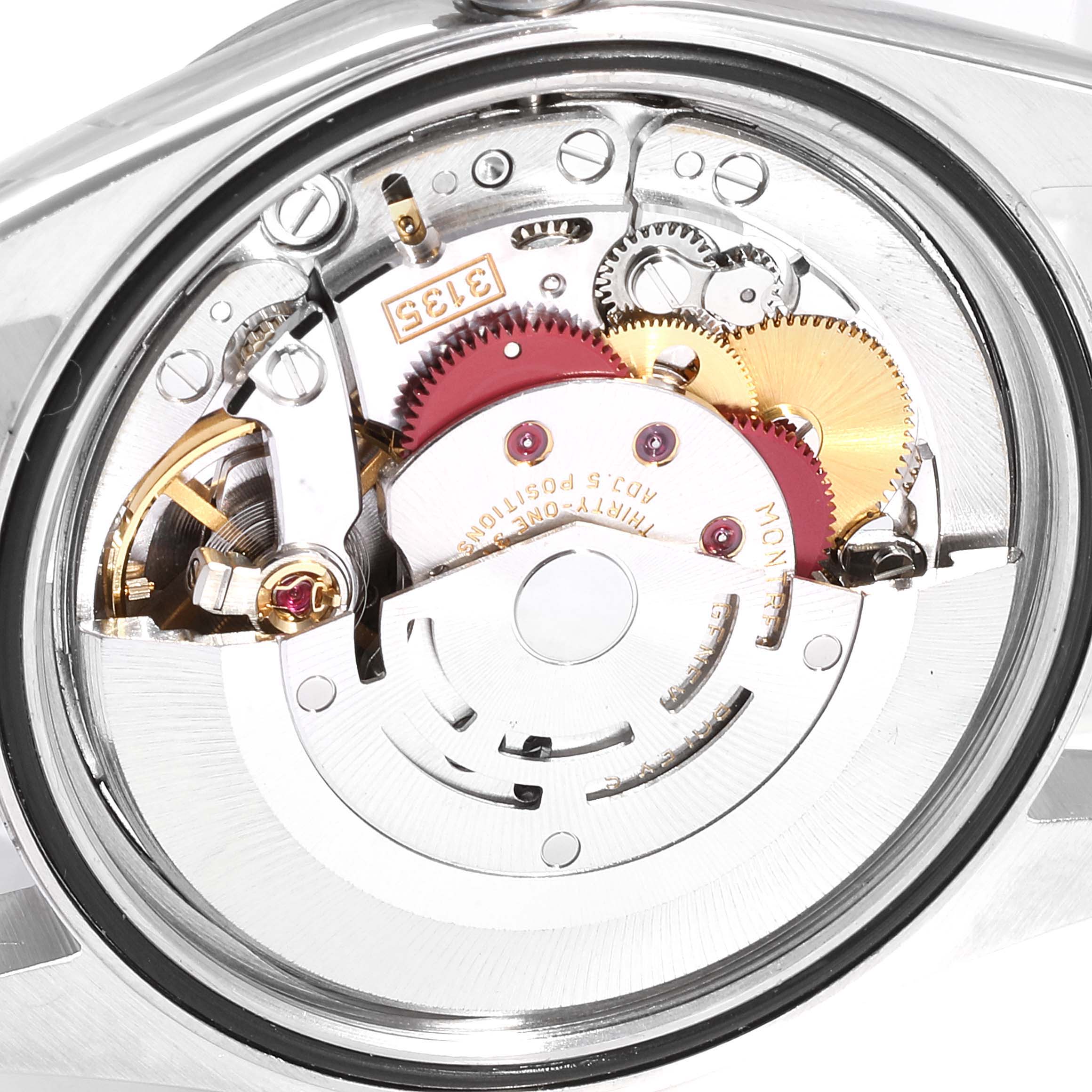 The image shows the internal mechanical movement of a Rolex Datejust 16200 Men
s Stainless Steel Blue Dial 16200 Men
s Stainless Steel Blue Dial watch, highlighting gears and components from a rear angle.