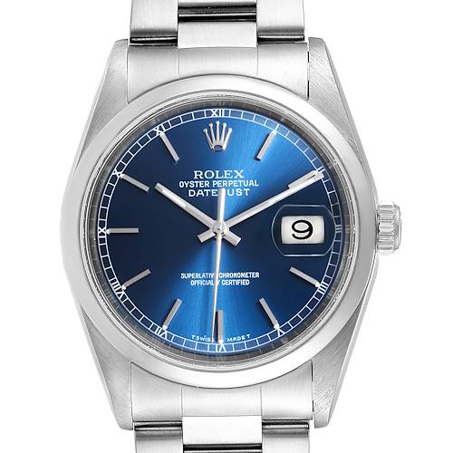 The image shows a front view of the Rolex Datejust watch, highlighting its blue dial, date window, and stainless steel bracelet.