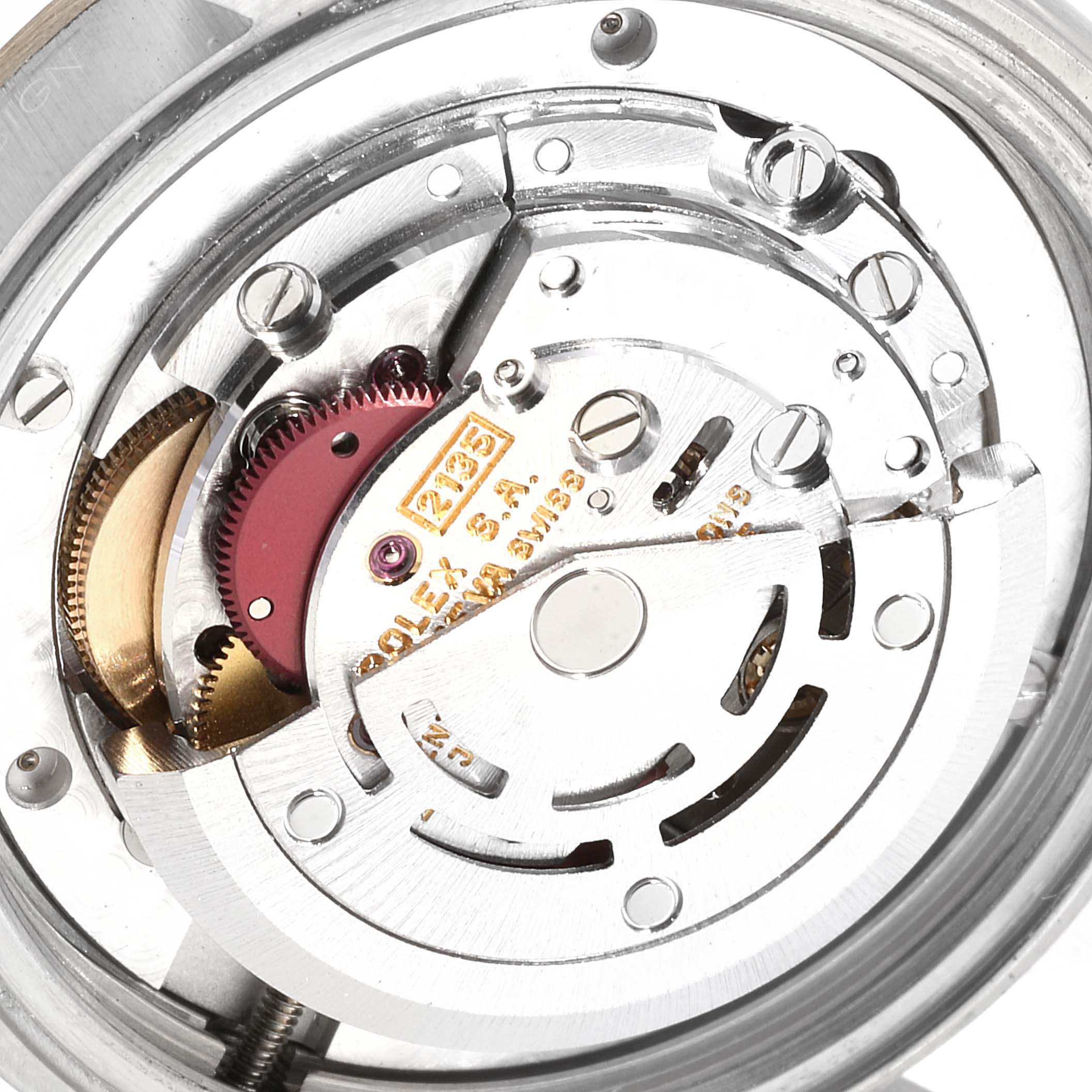 This image shows the internal mechanical movement of a Mid-Size Rolex watch from a top-down angle.