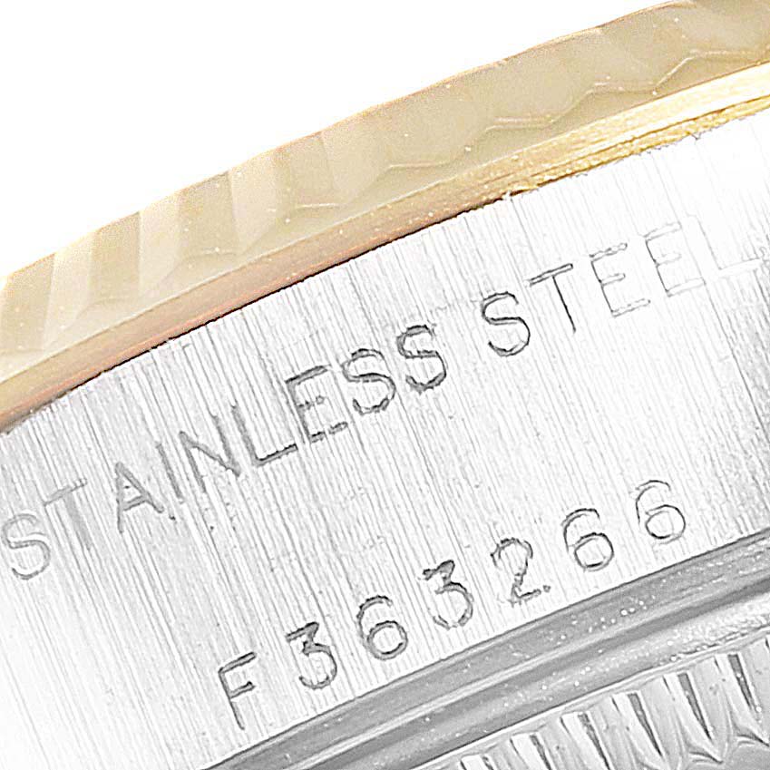 This image shows a close-up view of the side of a Rolex Datejust 79173 Women
s Steel and Gold (two tone) Champagne Dial 79173 Women
s Steel and Gold (two tone) Champagne Dial watch case, displaying "Stainless Steel."