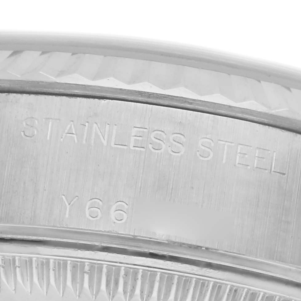 The image shows a close-up of the side of a Rolex Datejust 79174 Women
s Stainless Steel Pink Dial 79174 Women
s Stainless Steel Pink Dial, highlighting the stainless steel engraving.