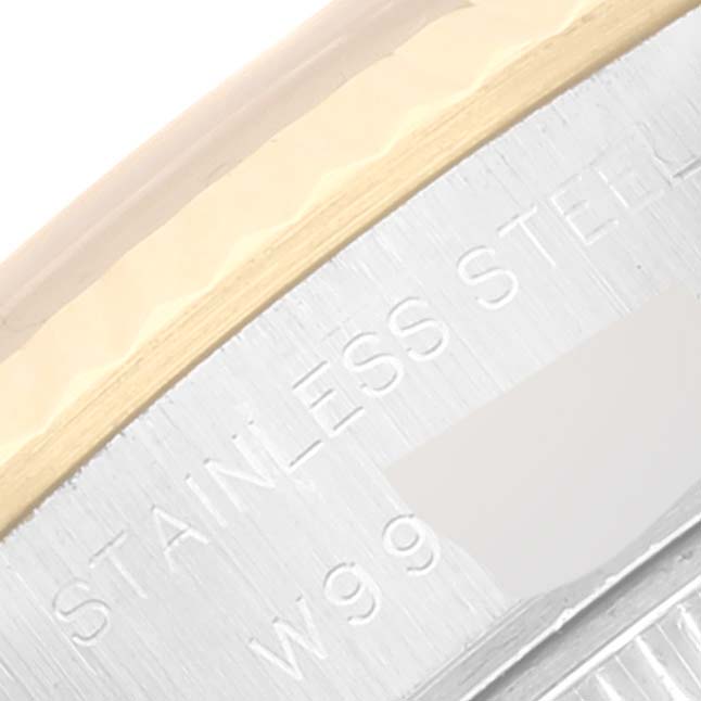This close-up shows the outer rim and part of the engraved text on a Rolex Datejust 69173 Women's Steel and Gold (two tone) Champagne Dial 69173 Women's Steel and Gold (two tone) Champagne Dial watch case.