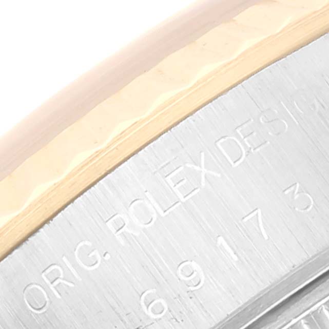This image shows a close-up of the case back of a Rolex Datejust 69173 Women's Steel and Gold (two tone) Champagne Dial 69173 Women's Steel and Gold (two tone) Champagne Dial watch with engraved text visible.