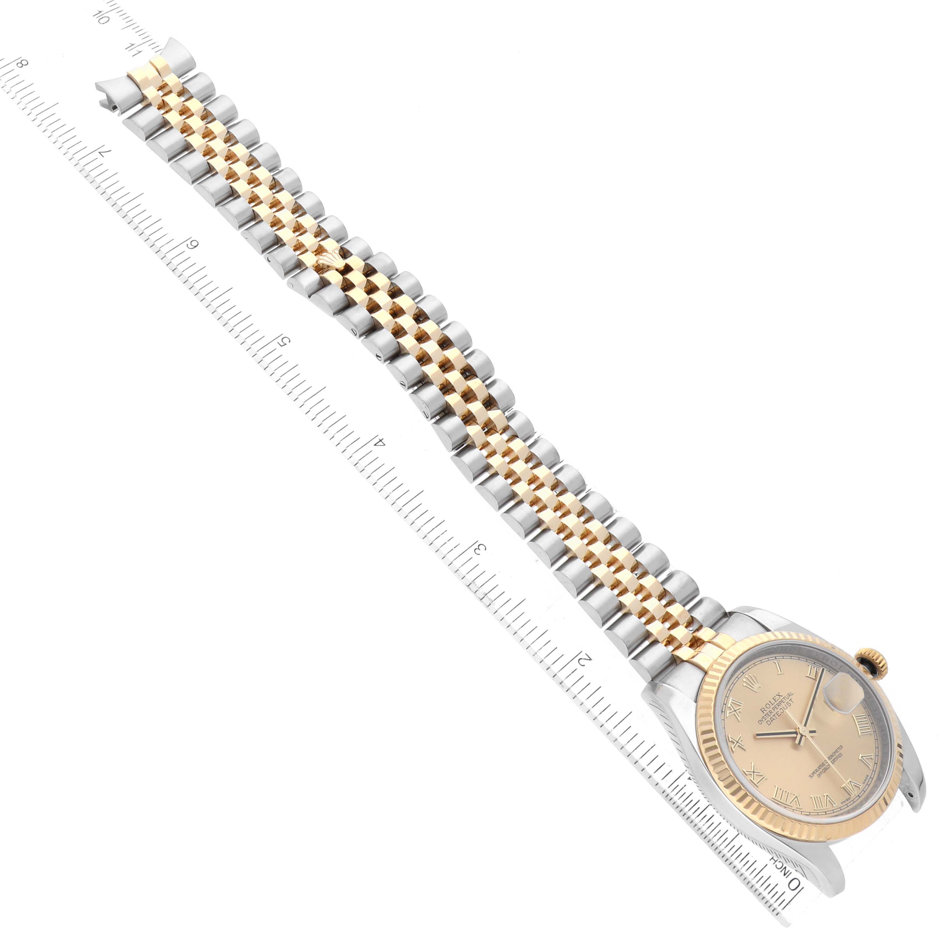 The image shows a Rolex Datejust 116233 Men's Steel and Gold (two tone) Champagne Dial 116233 Men's Steel and Gold (two tone) Champagne Dial watch laid flat with its band extended, alongside a ruler for scale.