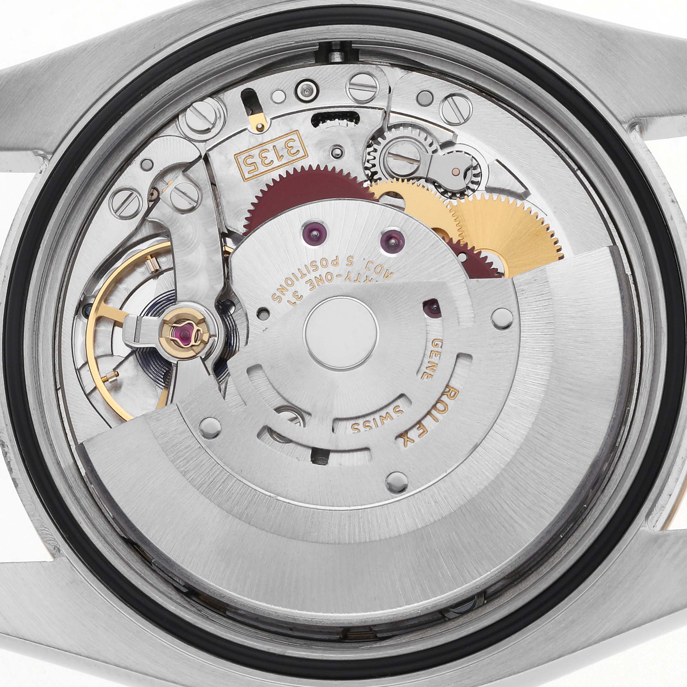 The image shows the movement of a Rolex Datejust 116233 Men
s Steel and Gold (two tone) Champagne Dial 116233 Men
s Steel and Gold (two tone) Champagne Dial watch from a back angle, highlighting gears and the rotor.