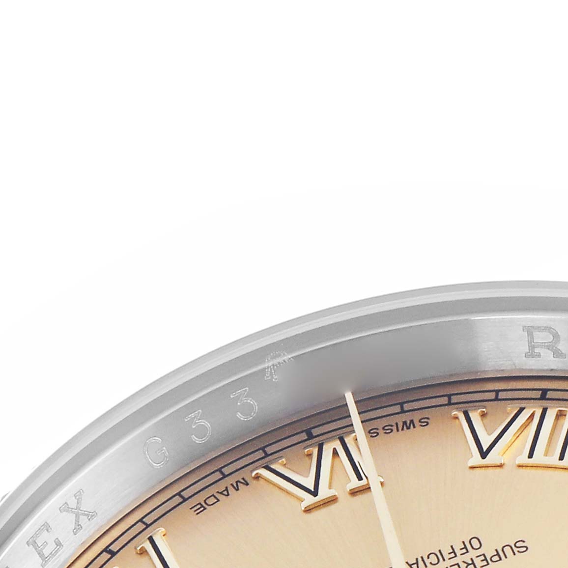 The image shows a close-up of the Rolex Datejust 116233 Men
s Steel and Gold (two tone) Champagne Dial 116233 Men
s Steel and Gold (two tone) Champagne Dial
s bezel and partial dial with Roman numerals.