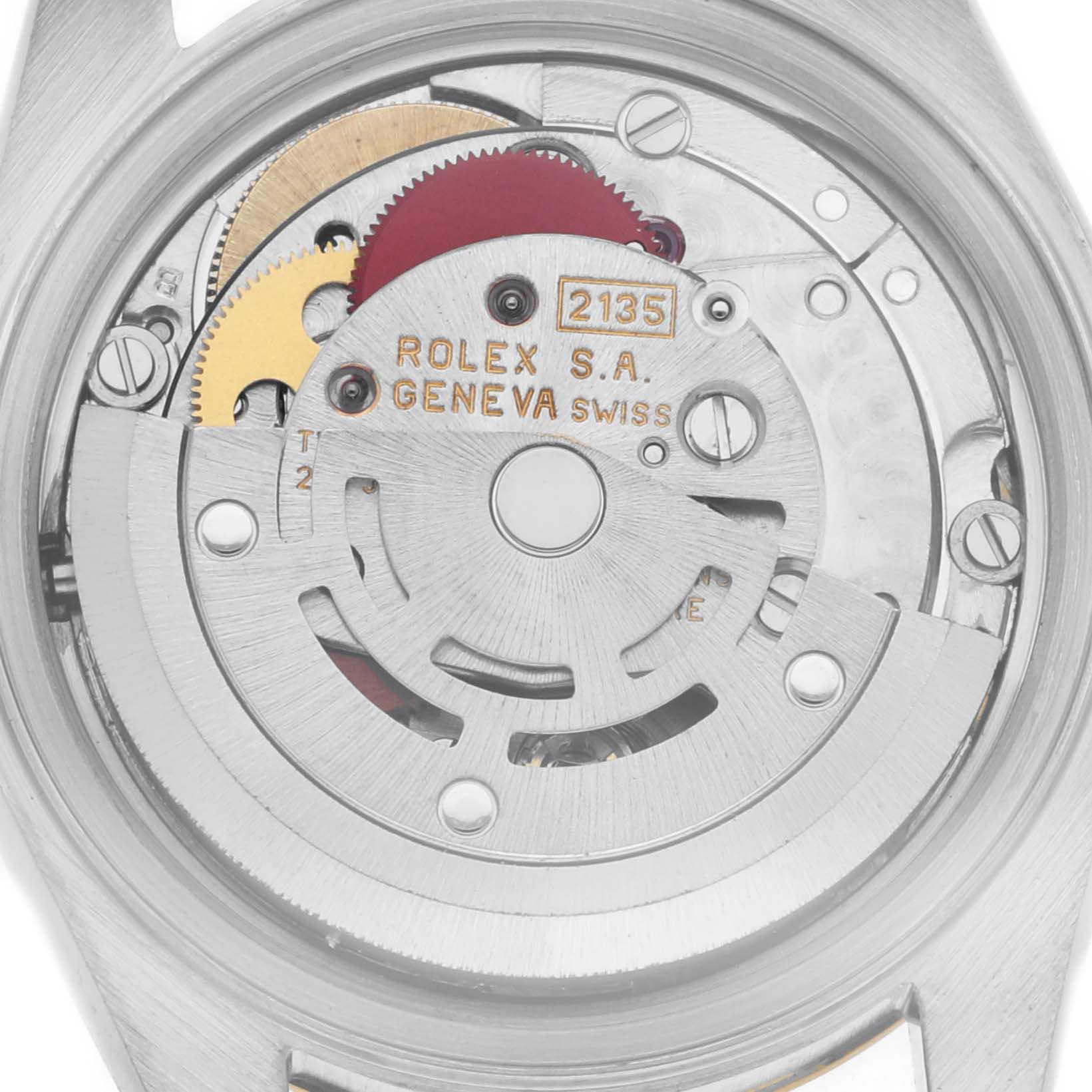 The image shows the movement mechanism of a Rolex Datejust 69173 Women
s Steel and Gold (two tone) Champagne Dial 69173 Women
s Steel and Gold (two tone) Champagne Dial from a top-down angle, highlighting gears and the oscillating weight.