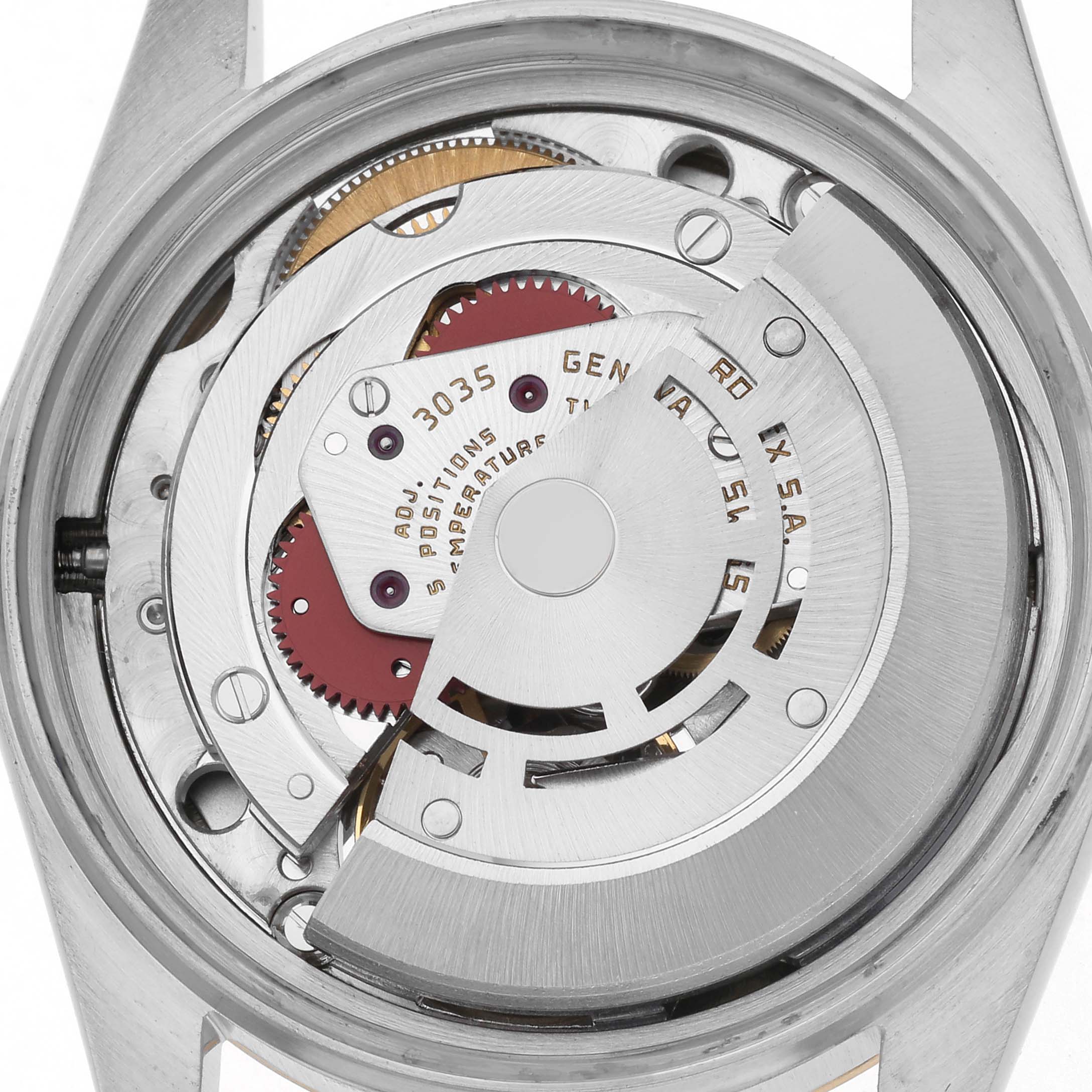 The image shows the movement of a Rolex Datejust 16013 Men
s Steel and Gold (two tone) Champagne Dial 16013 Men
s Steel and Gold (two tone) Champagne Dial watch, highlighting gears and the rotor from a rear angle.