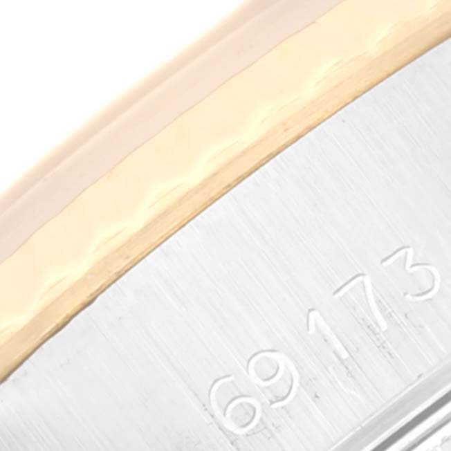 This image shows a close-up view of the case edge and model number "69173" of a Rolex Datejust 69173 Women's Steel and Gold (two tone) White Dial 69173 Women's Steel and Gold (two tone) White Dial watch.