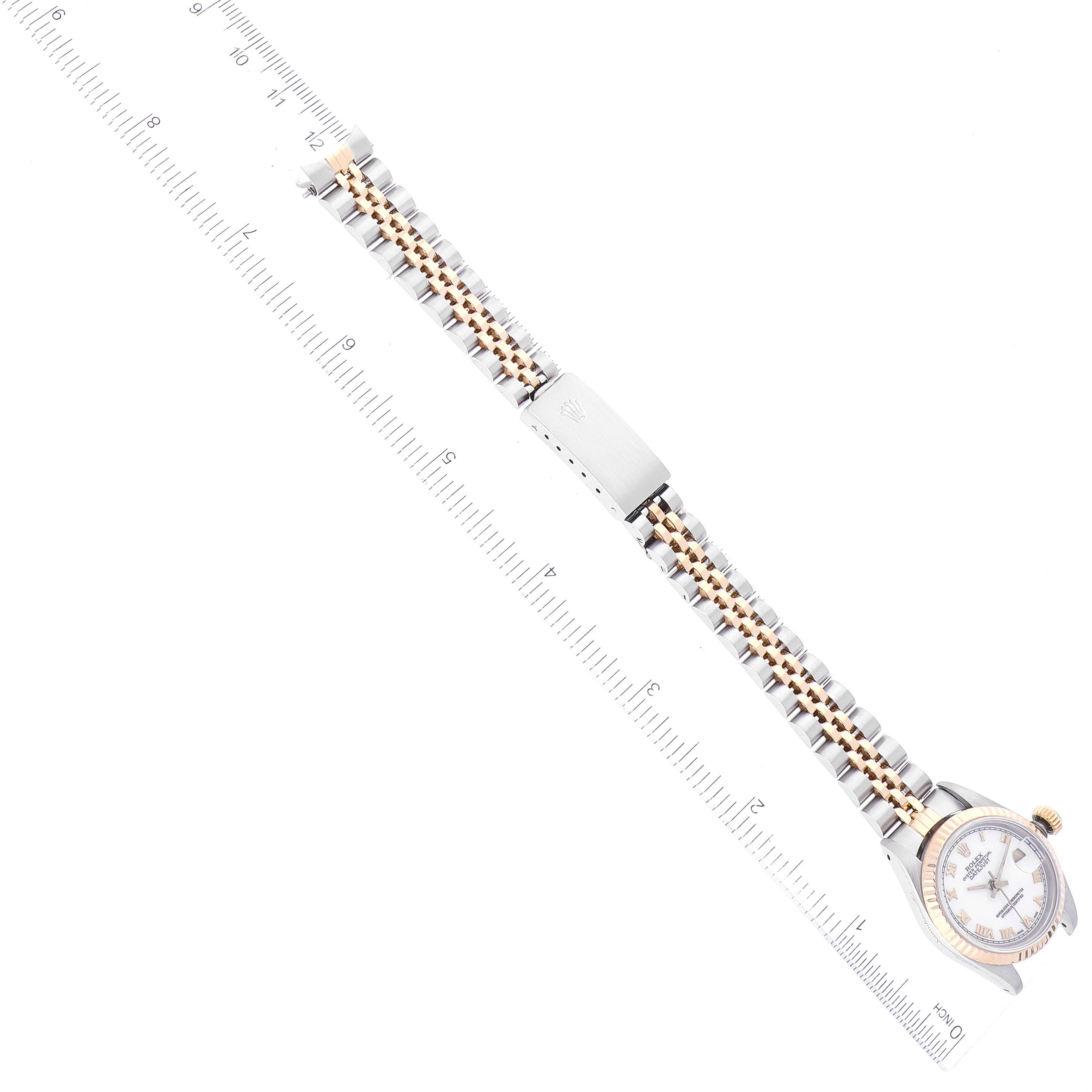 The image shows a Rolex Datejust 69173 Women's Steel and Gold (two tone) White Dial 69173 Women's Steel and Gold (two tone) White Dial watch laying flat with its face, bezel, bracelet, and clasp aligned alongside a ruler for scale.