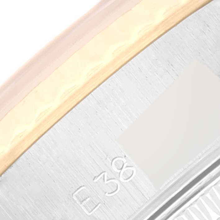 This close-up image shows part of the bezel and side of the Rolex Datejust 69173 Women's Steel and Gold (two tone) White Dial 69173 Women's Steel and Gold (two tone) White Dial watch.