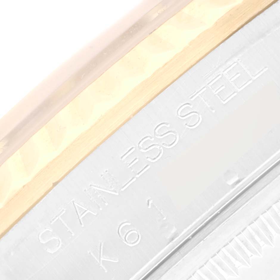 The image shows a close-up of the side of a Rolex Datejust 16233 Men's Steel and Gold (two tone) White Dial 16233 Men's Steel and Gold (two tone) White Dial, highlighting the stainless steel engraving and bezel.