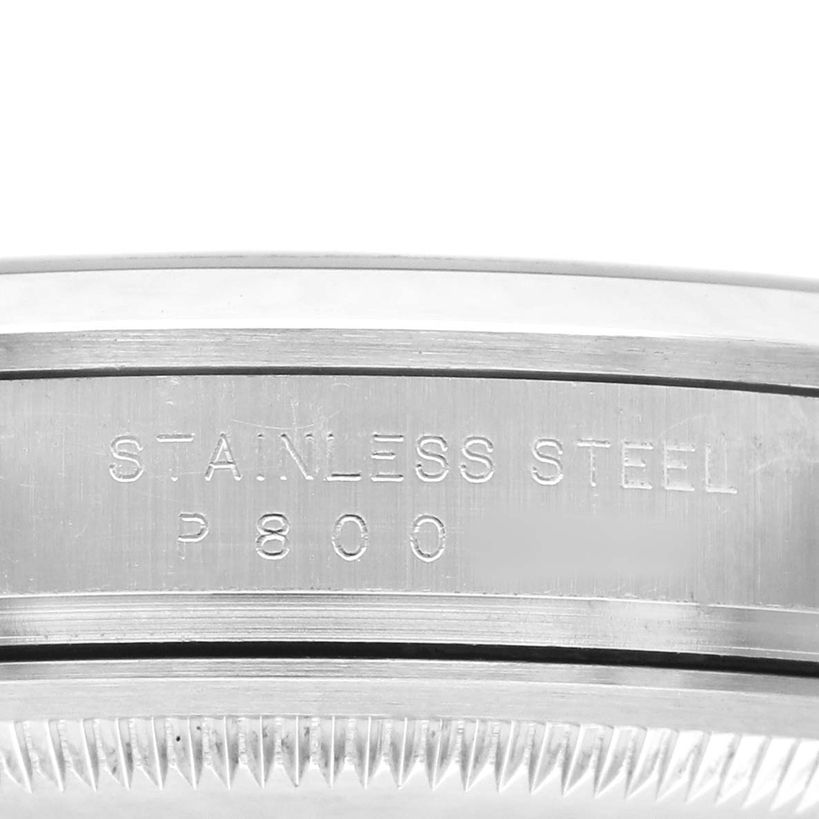 The image shows a close-up of the side view of the stainless steel bezel of a Rolex Explorer 114270 Men's Stainless Steel Black Dial watch.