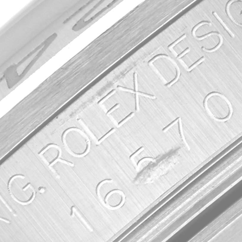 This close-up image shows the engraved model number and "Rolex Design" text on the side of a Rolex Explorer 16570 Men
s Stainless Steel Black Dial 16570 Men
s Stainless Steel Black Dial watch case.
