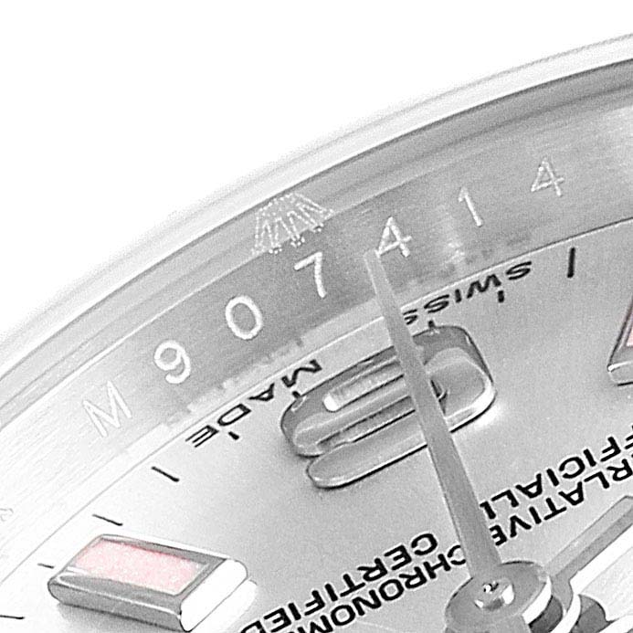 A close-up of the Rolex Oyster Perpetual 176234 Women's Stainless Steel Silver Dial 176234 Women's Stainless Steel Silver Dial watch face shows the dial, hands, and part of the inner bezel with serial numbers.