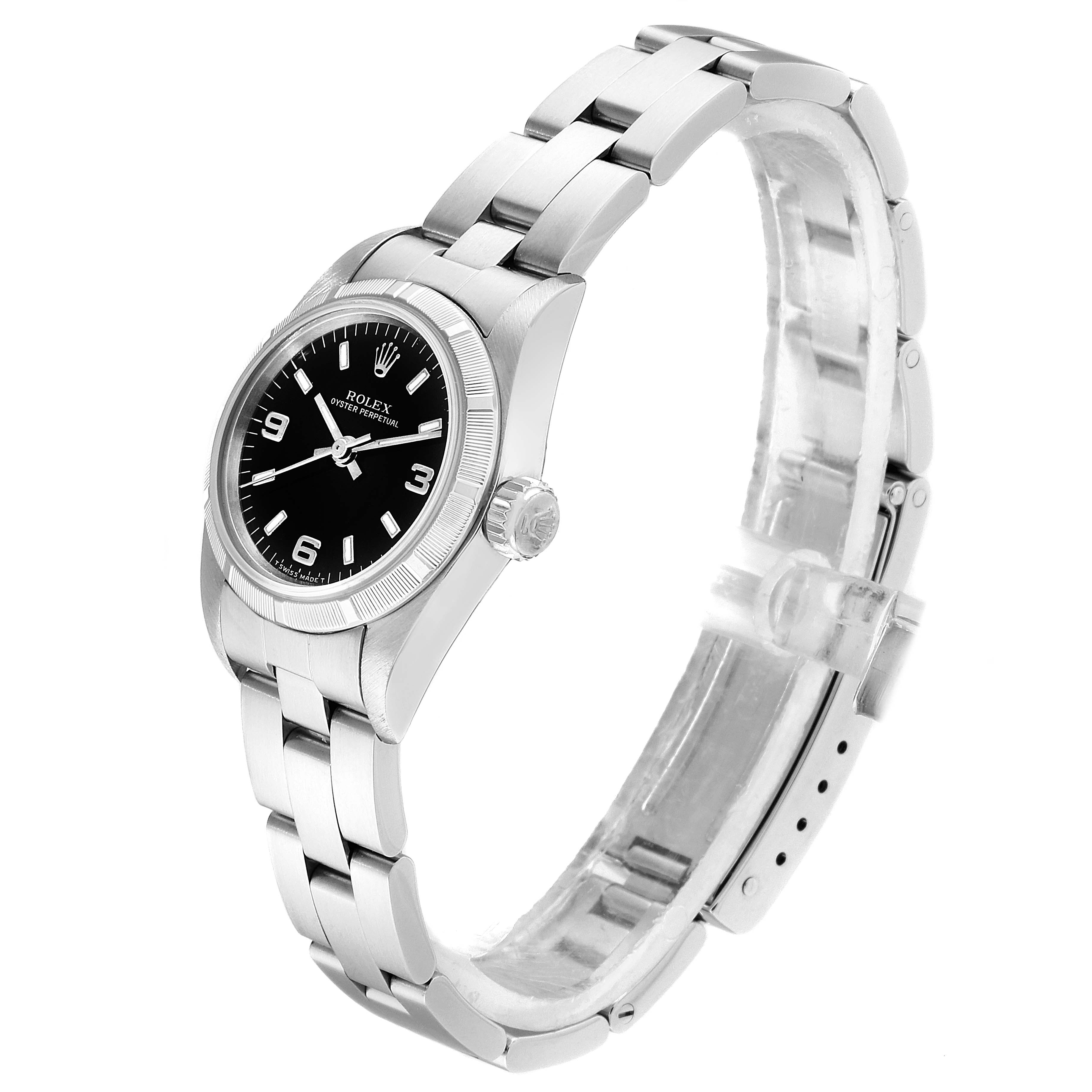 This Rolex Oyster Perpetual 67230 Women
s Stainless Steel Black Dial 67230 Women
s Stainless Steel Black Dial watch is shown at a 3/4 angle, displaying its face, crown, case, and bracelet.