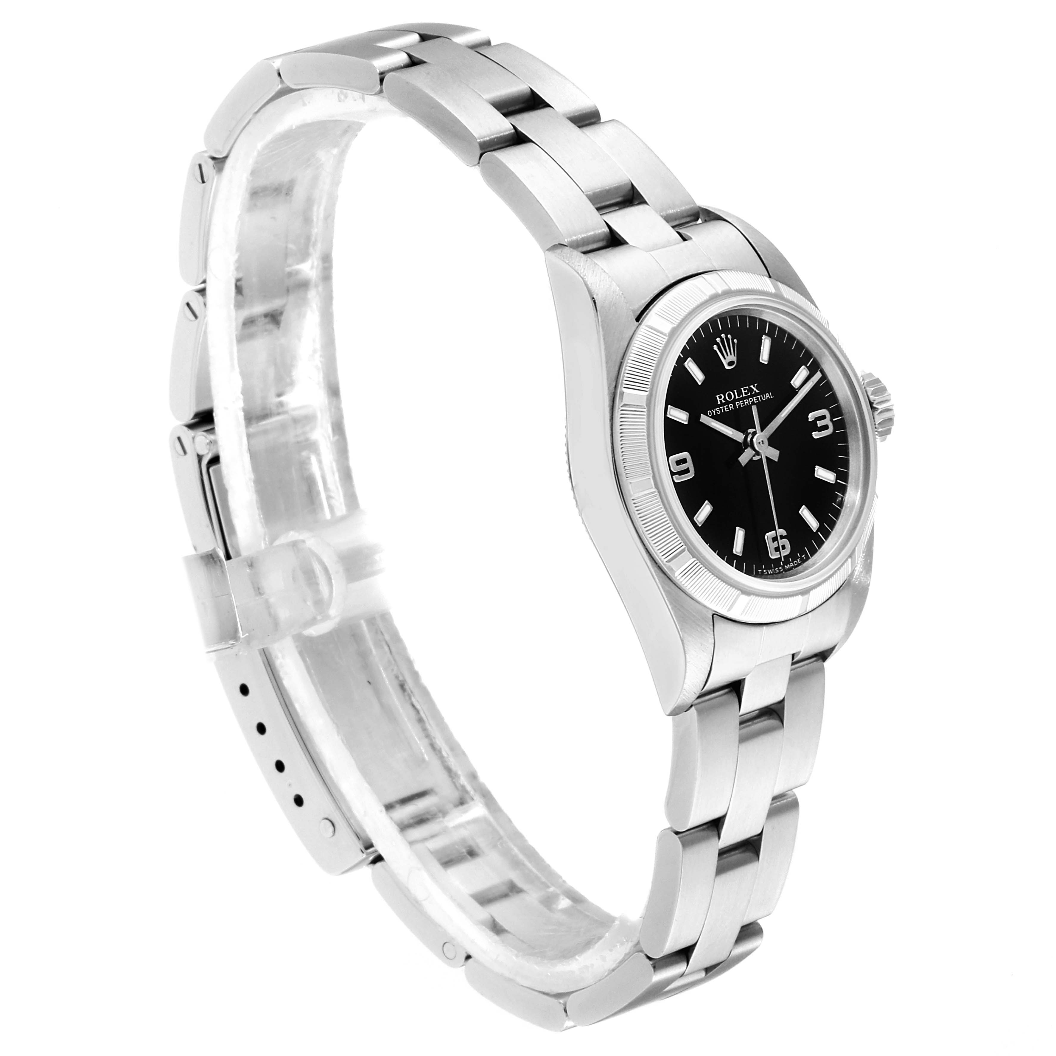 The image shows a side view of a Rolex Oyster Perpetual 67230 Women
s Stainless Steel Black Dial 67230 Women
s Stainless Steel Black Dial watch, highlighting its black dial and stainless steel bracelet.