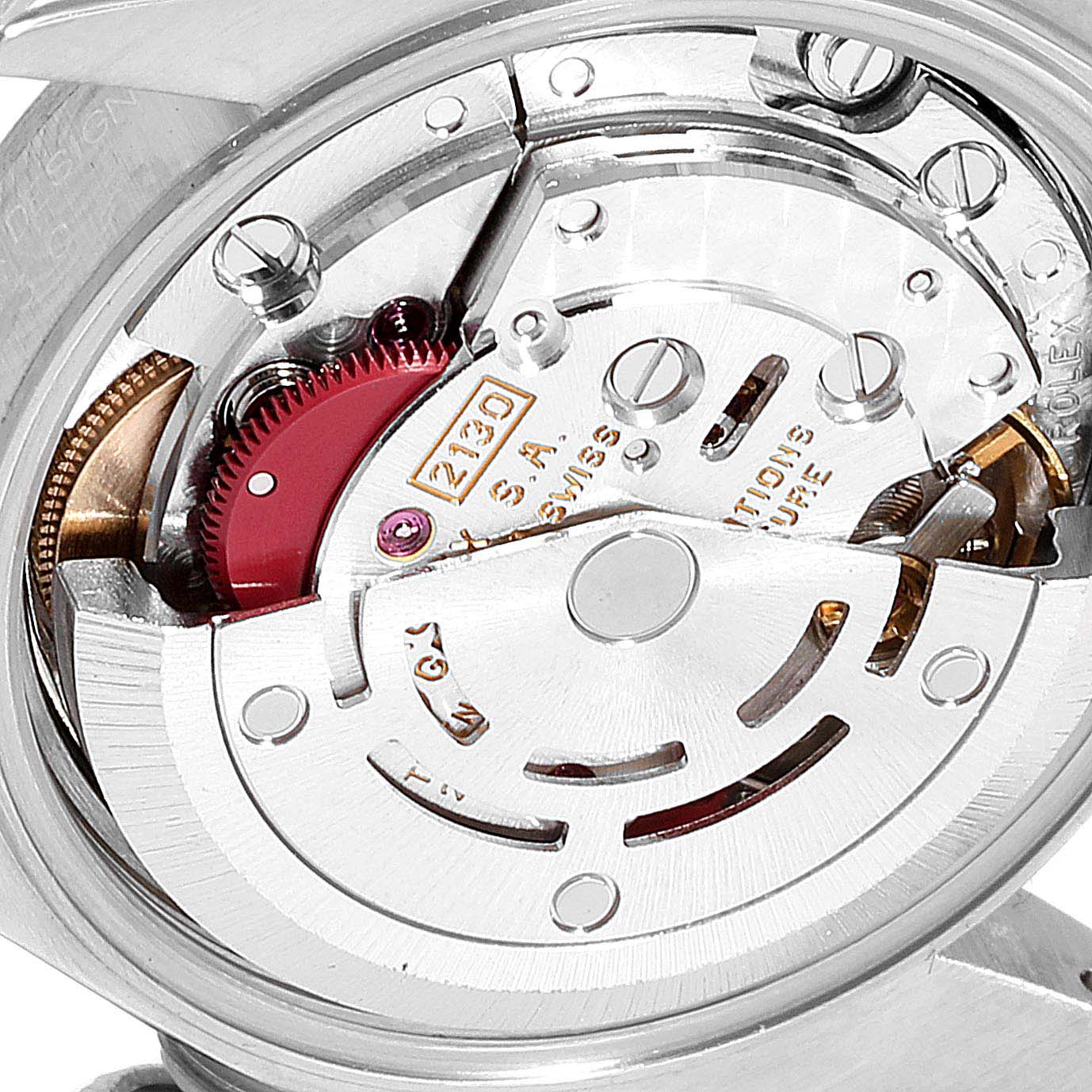 This image shows the intricate internal mechanical movement of a Rolex Oyster Perpetual 67230 Women
s Stainless Steel Black Dial 67230 Women
s Stainless Steel Black Dial watch from a close-up angle.