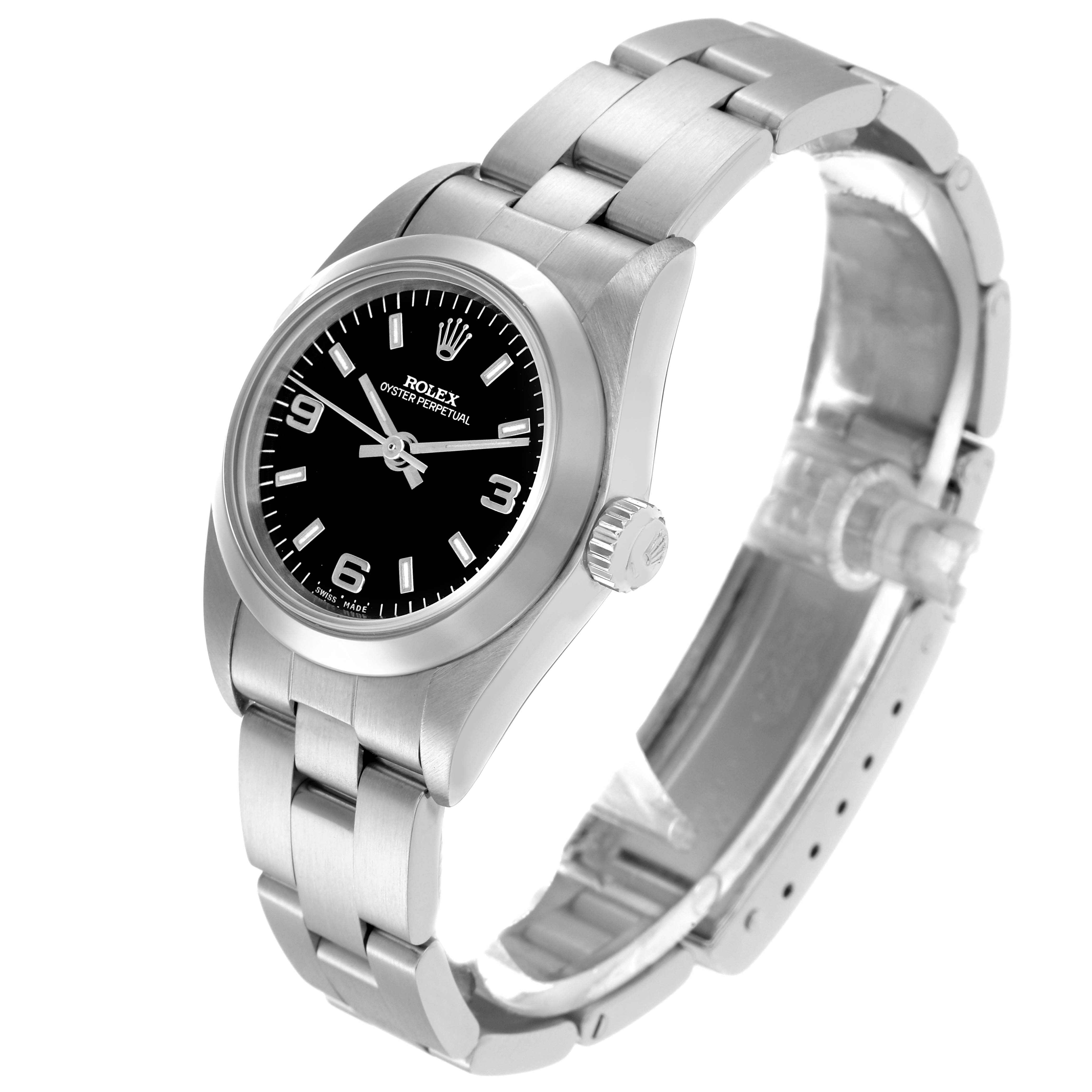 The Rolex Oyster Perpetual 76080 Women
s Stainless Steel Black Dial 76080 Women
s Stainless Steel Black Dial watch is shown at an angle highlighting the face, bezel, bracelet, and crown.