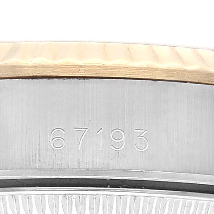 This image shows a close-up view of the engraved model number "67193" on the side of a Rolex Oyster Perpetual 67193 Women's Steel and Gold (two tone) Silver Dial 67193 Women's Steel and Gold (two tone) Silver Dial watch case.