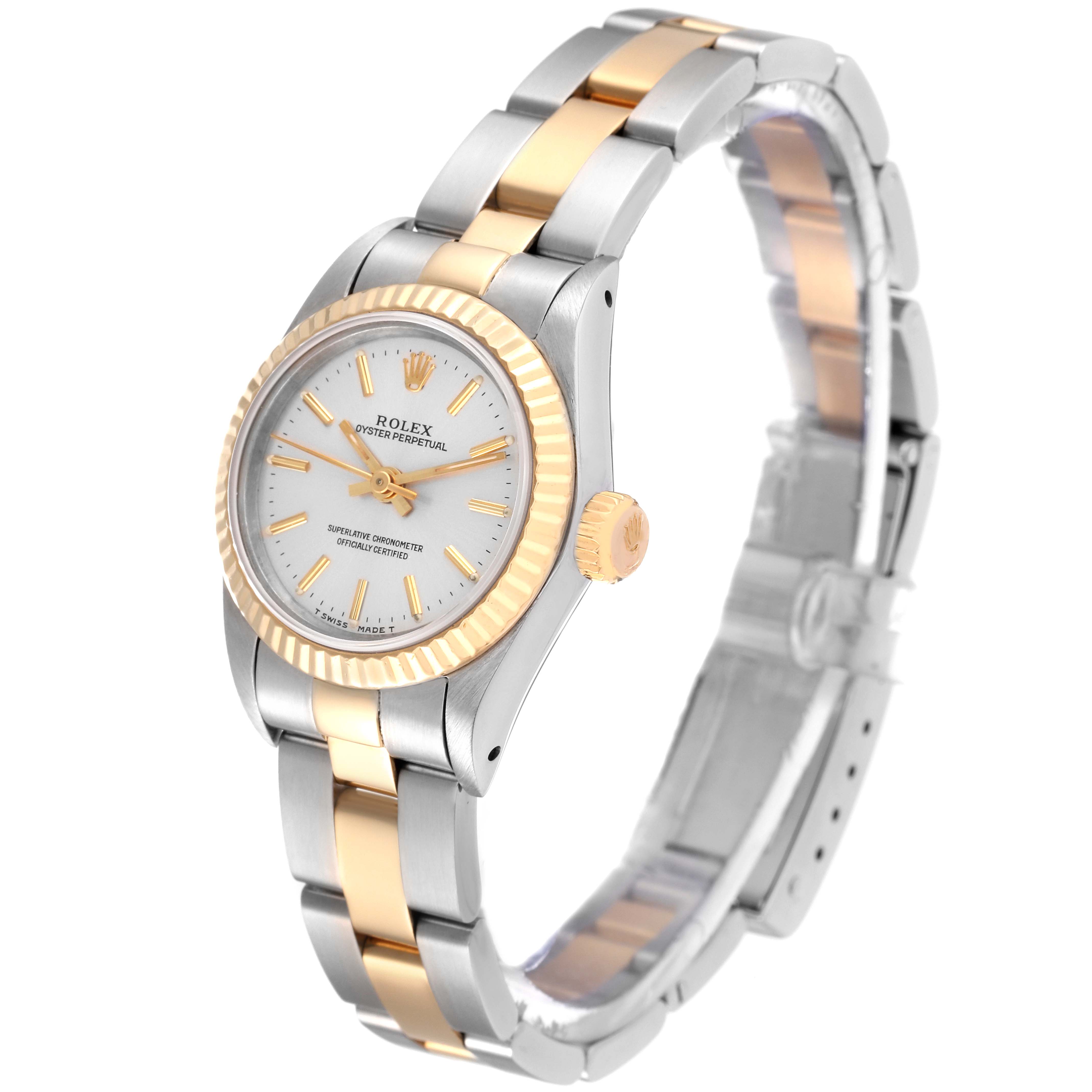 The Rolex Oyster Perpetual 67193 Women's Steel and Gold (two tone) Silver Dial 67193 Women's Steel and Gold (two tone) Silver Dial watch is shown at an angle displaying the face, bezel, crown, and part of the bracelet.