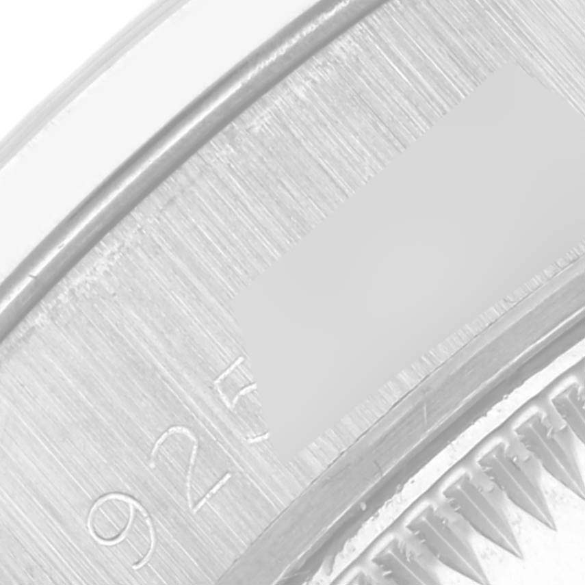 This is a close-up view of the watch back and case of the Rolex President 69159 Women's White Gold Silver Dial 69159 Women's White Gold Silver Dial model, showing engraved details.