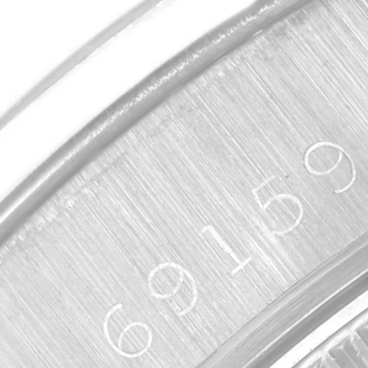 This is a close-up view of the case, showing the serial number of the Rolex President 69159 Women's White Gold Silver Dial 69159 Women's White Gold Silver Dial model watch.