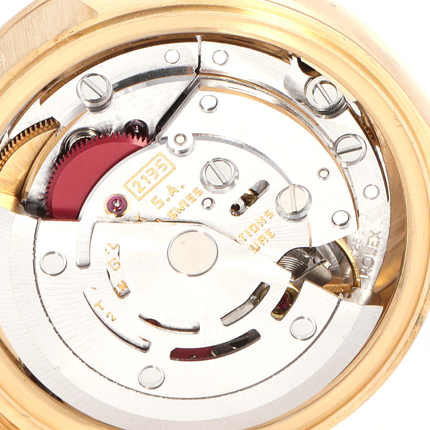 This close-up image shows the intricate movement and inner mechanism of a Rolex President 69178 Women's Yellow Gold Black Dial 69178 Women's Yellow Gold Black Dial model watch.