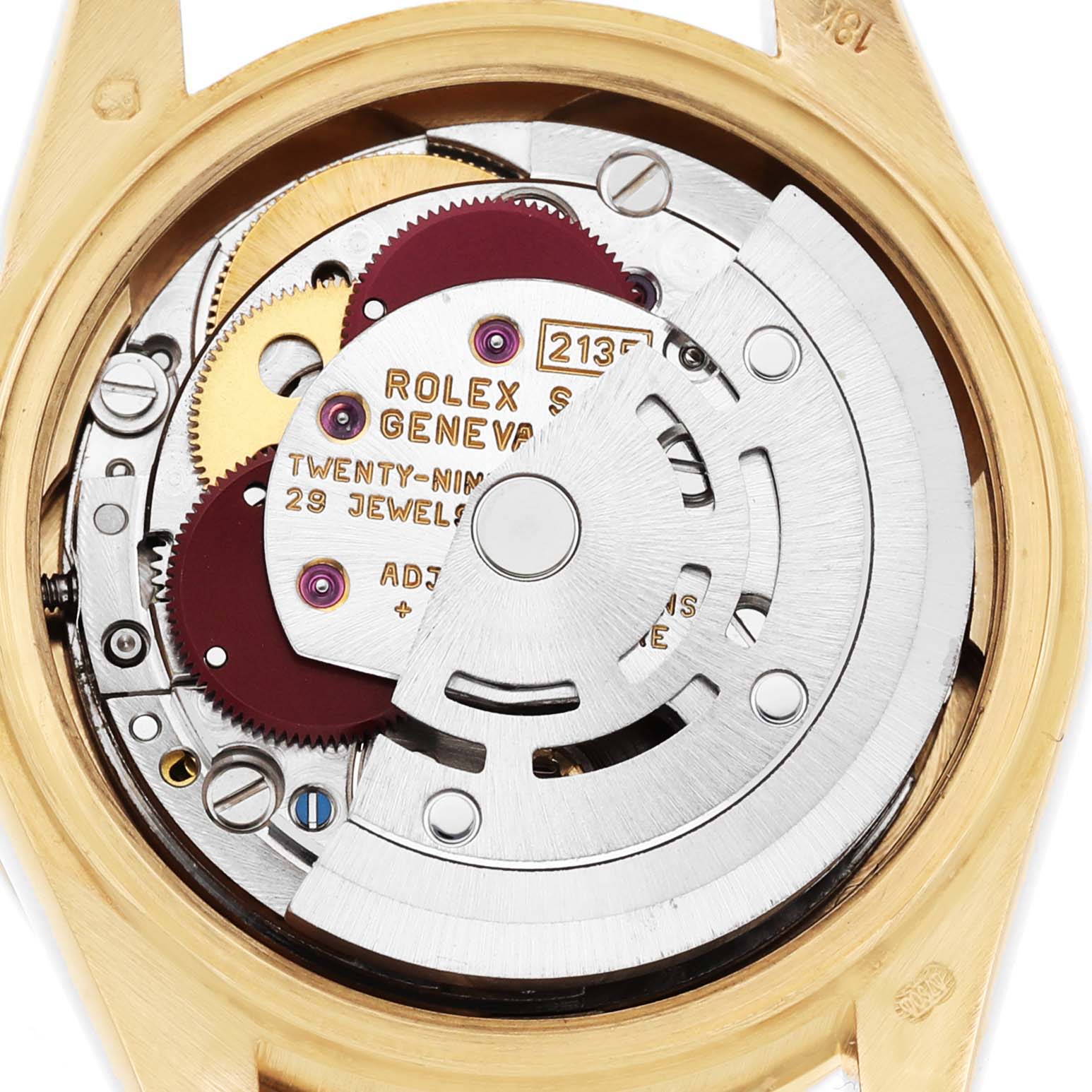 The image shows the movement and internal components of a Rolex President 69068 Women's Yellow Gold Champagne Dial watch from a back angle with visible gears and text.