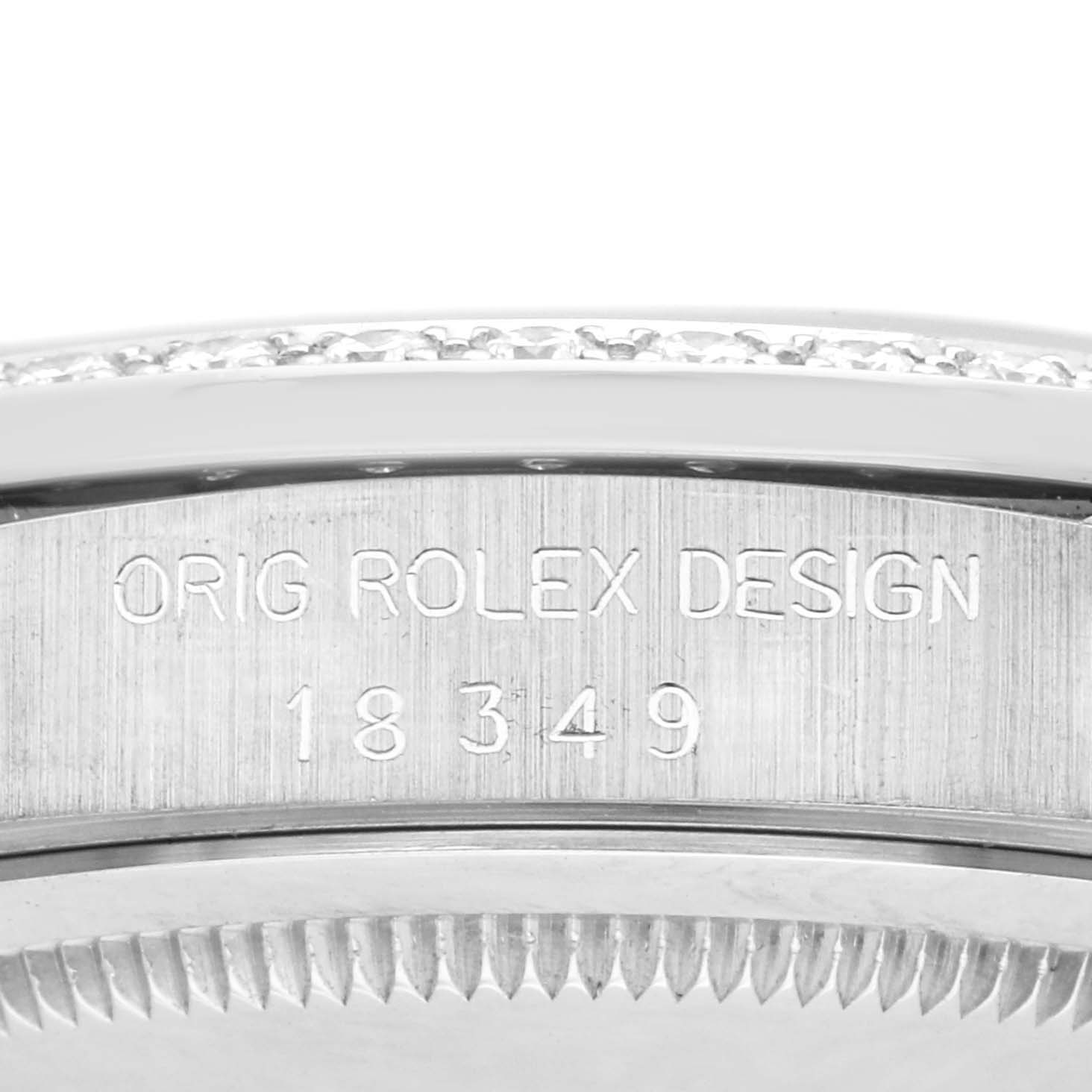 The image shows a close-up side view of the Rolex President 18349 Men
s White Gold Silver Dial 18349 Men
s White Gold Silver Dial model
s casing with engraved design details and serial numbers.