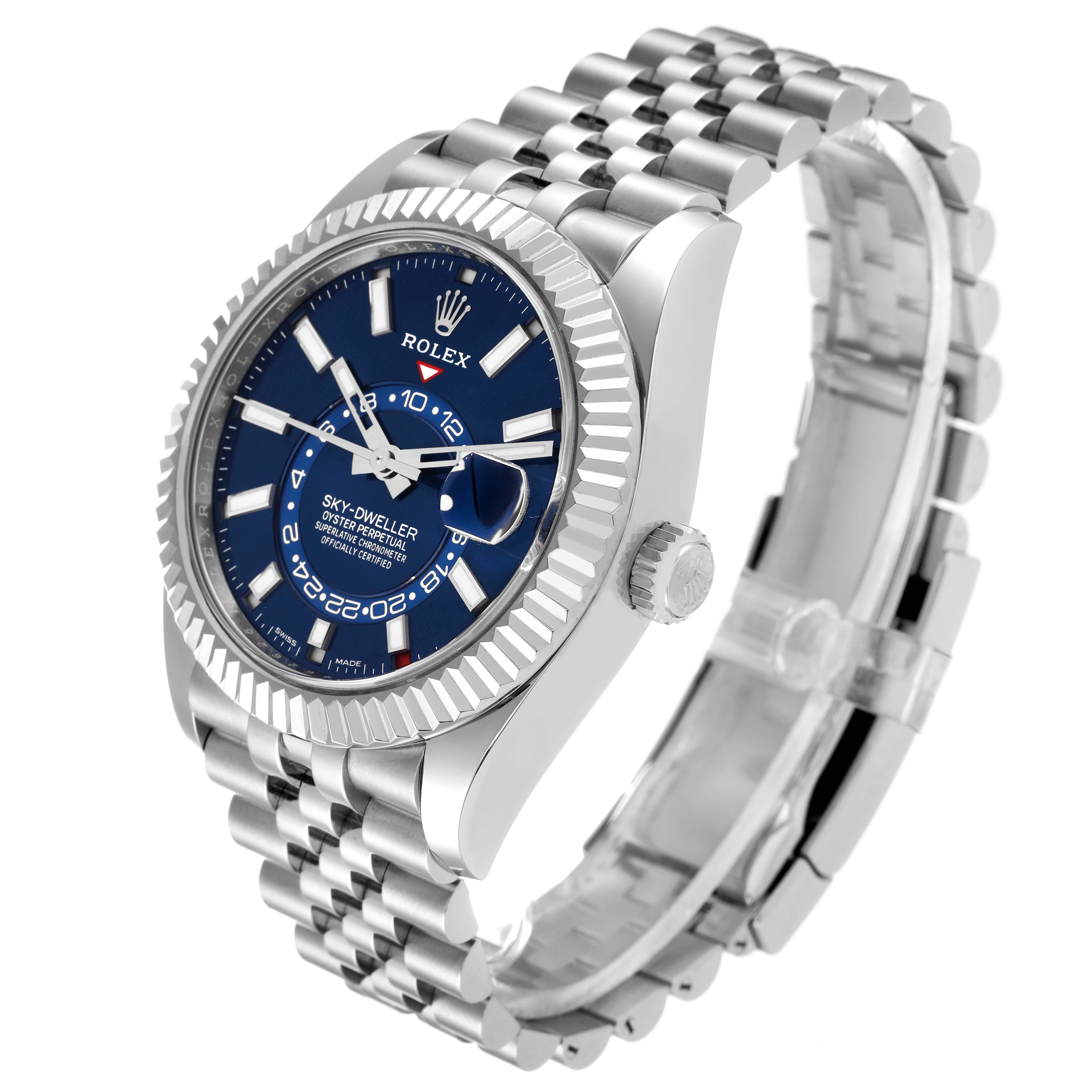 The image shows a Rolex Sky-Dweller 326934 Men
s Stainless Steel Blue Dial 326934 Men
s Stainless Steel Blue Dial watch at a three-quarter angle, highlighting the blue dial, bezel, and part of the bracelet.