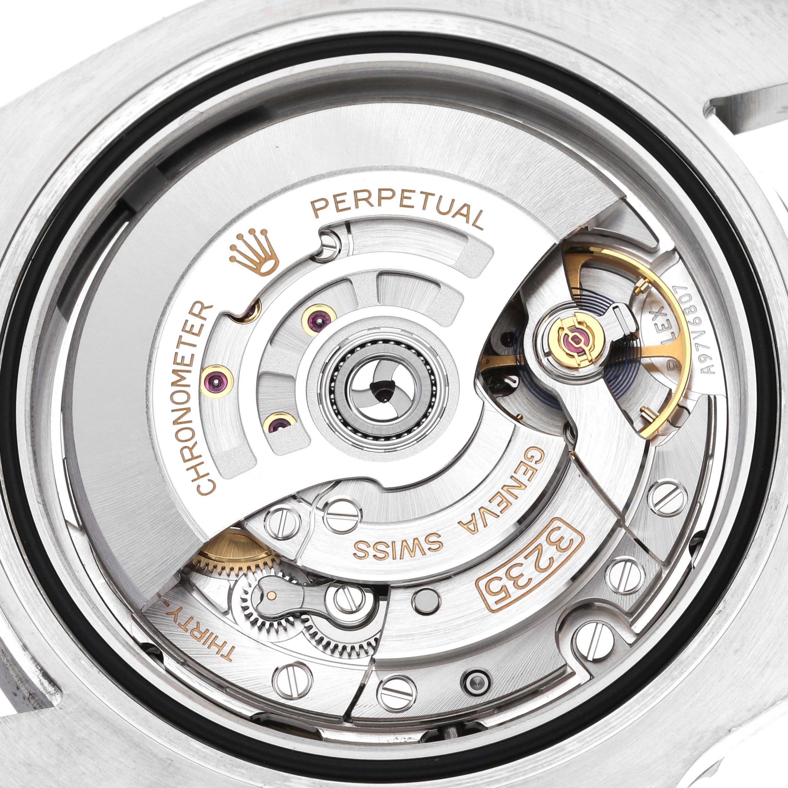 The image shows the intricate internal mechanics of a Rolex Submariner 126610 Men
s Stainless Steel Black Dial 126610 Men
s Stainless Steel Black Dial watch, highlighting the movement and winding rotor.