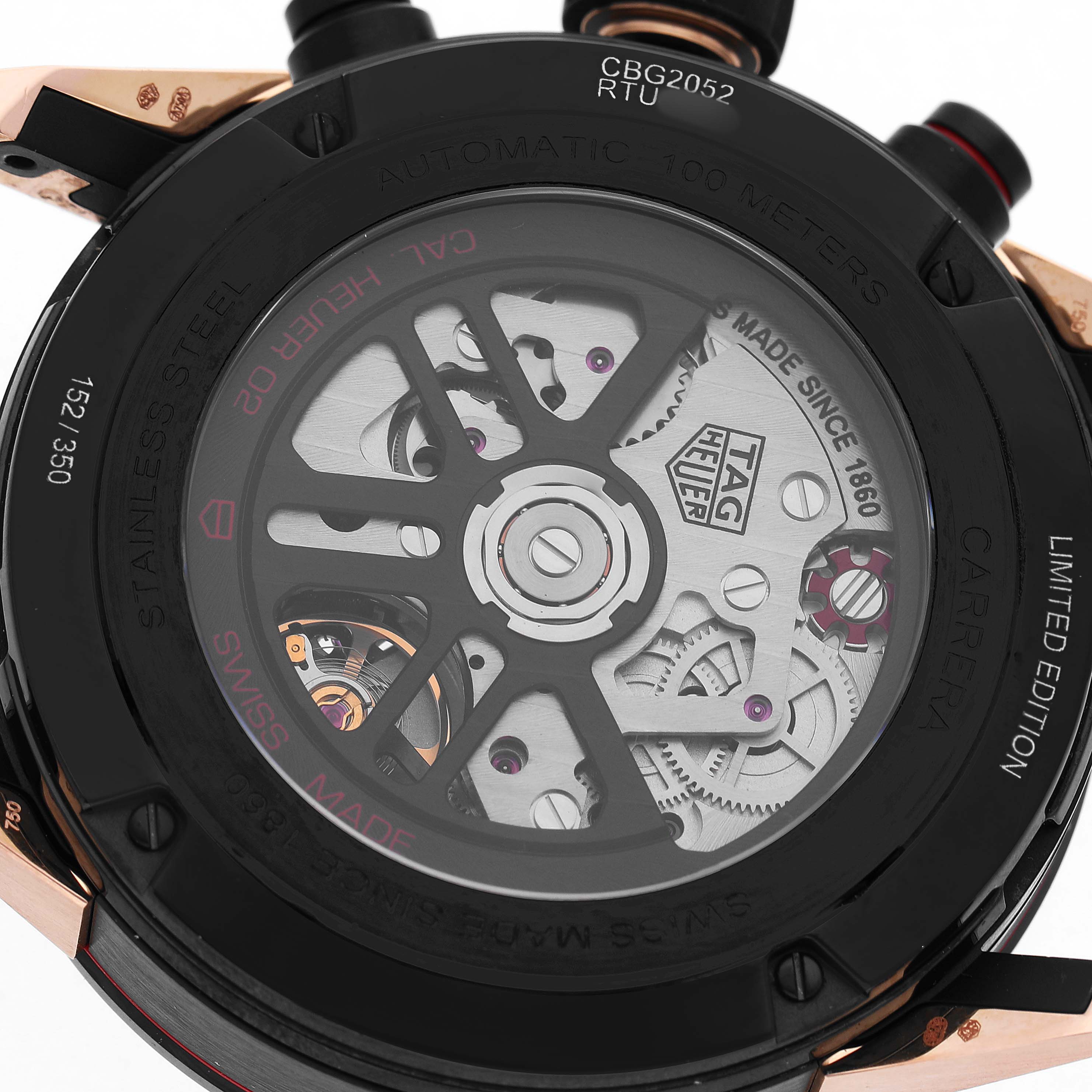 The image shows the back view of a Tag Heuer Carrera CBG2052 Men's Steel and Gold (two tone) Black Dial watch, highlighting its exposed movement and engravings.