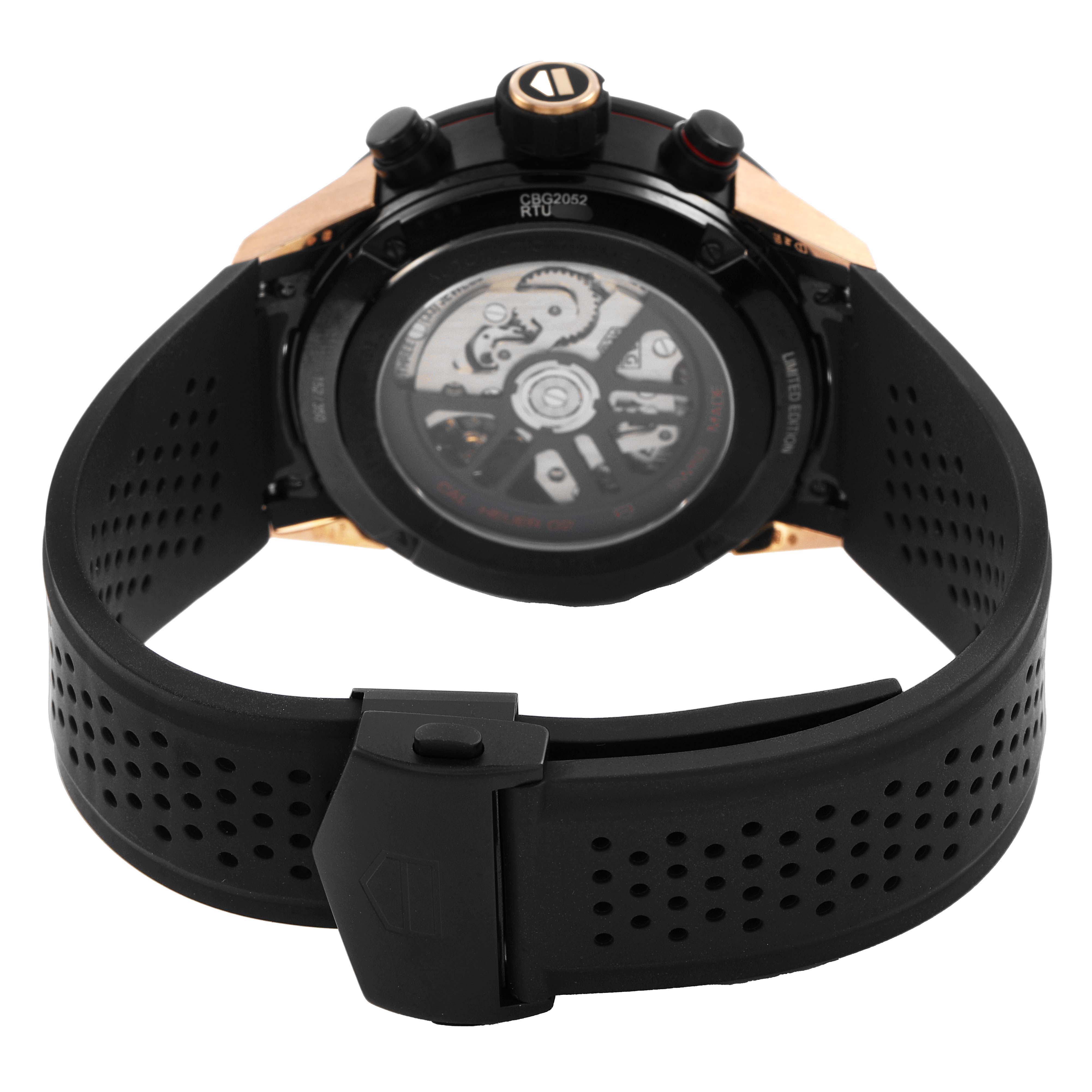 The Tag Heuer Carrera CBG2052 Men's Steel and Gold (two tone) Black Dial watch is displayed from the back, showing the transparent case back and the black perforated strap.