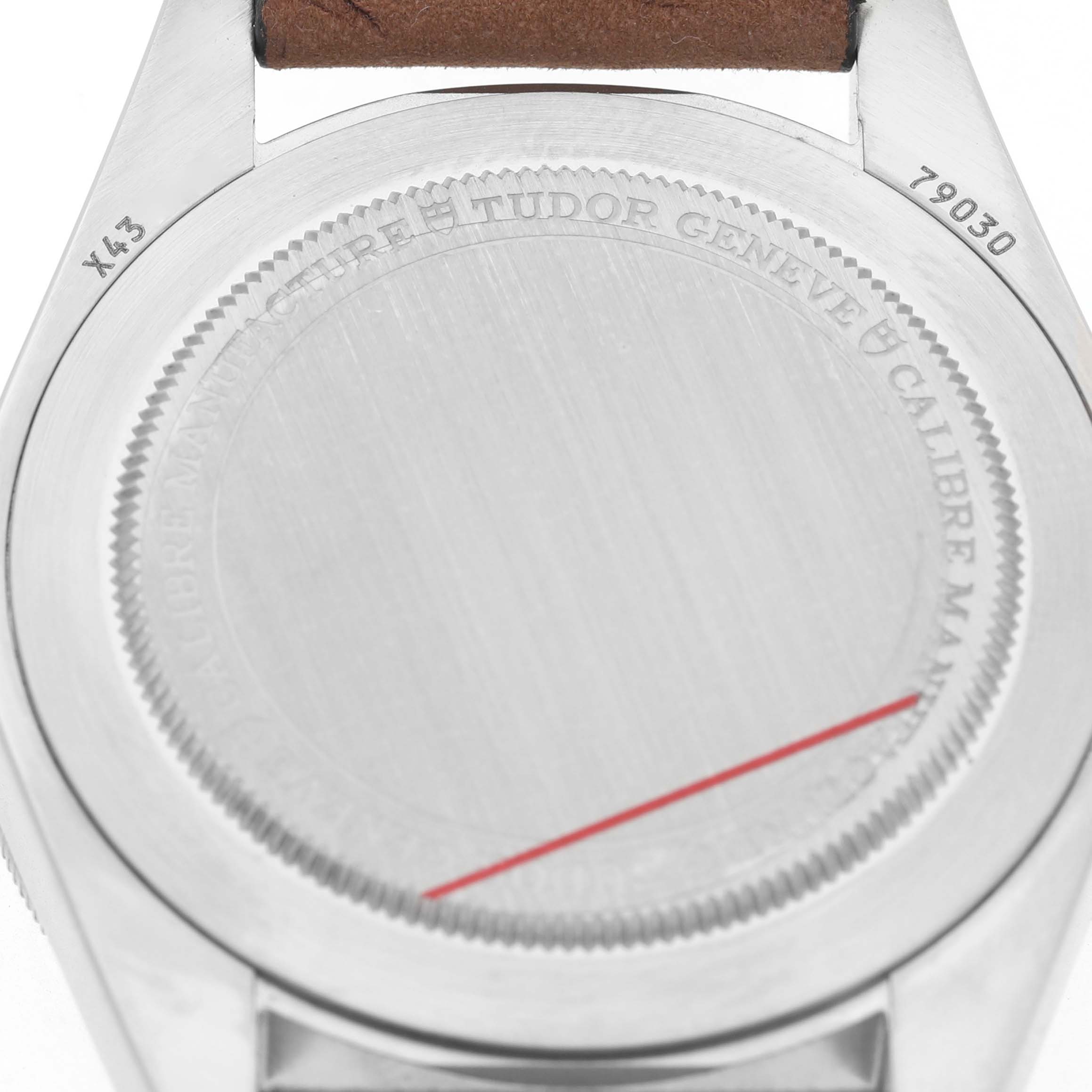 The image shows the back case of a Tudor Heritage Black Bay 79030 Men's Stainless Steel Black Dial watch, highlighting the caseback engravings and part of the strap.