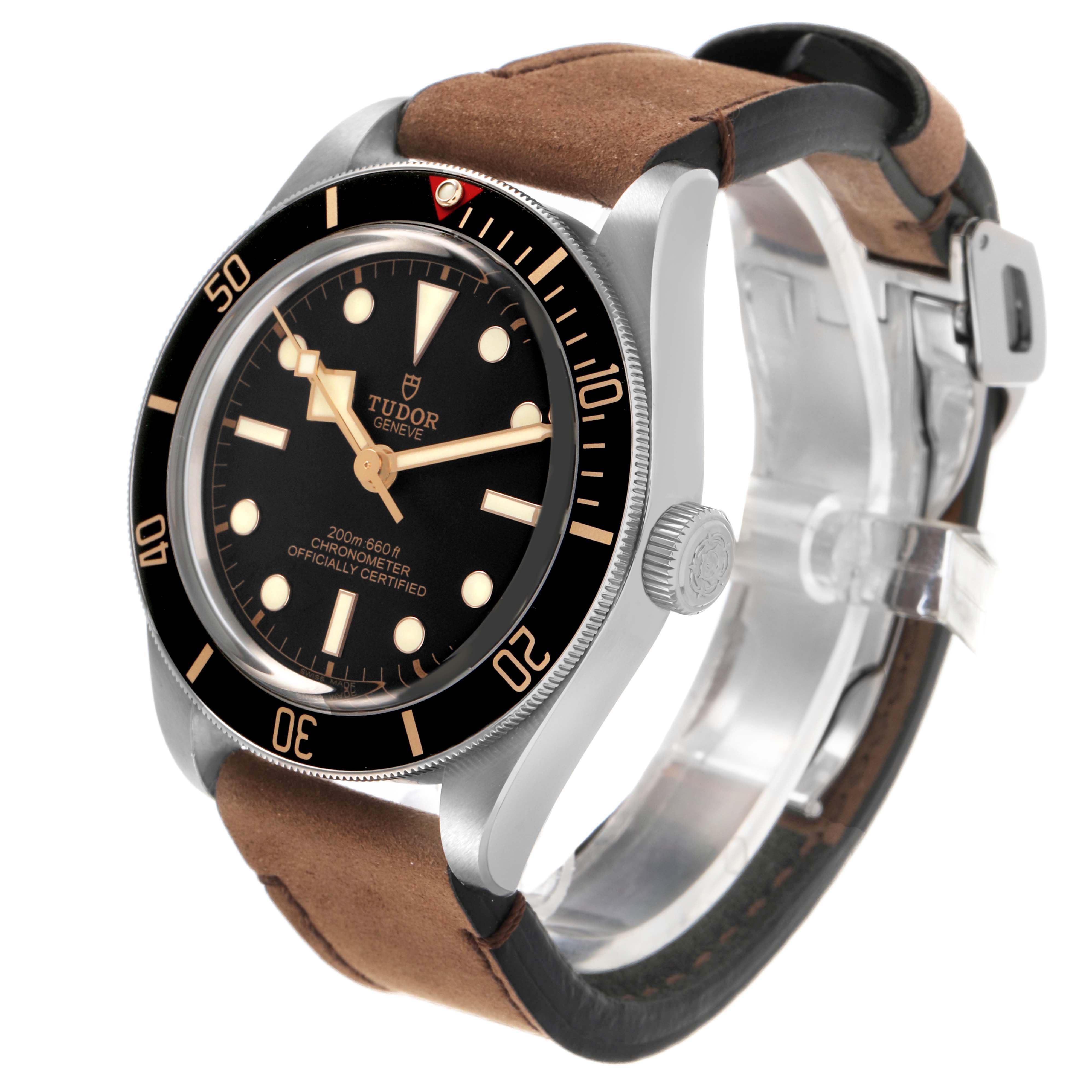 The Tudor Heritage Black Bay 79030 Men's Stainless Steel Black Dial watch is shown at an angle highlighting the case, bezel, dial, crown, and leather strap.