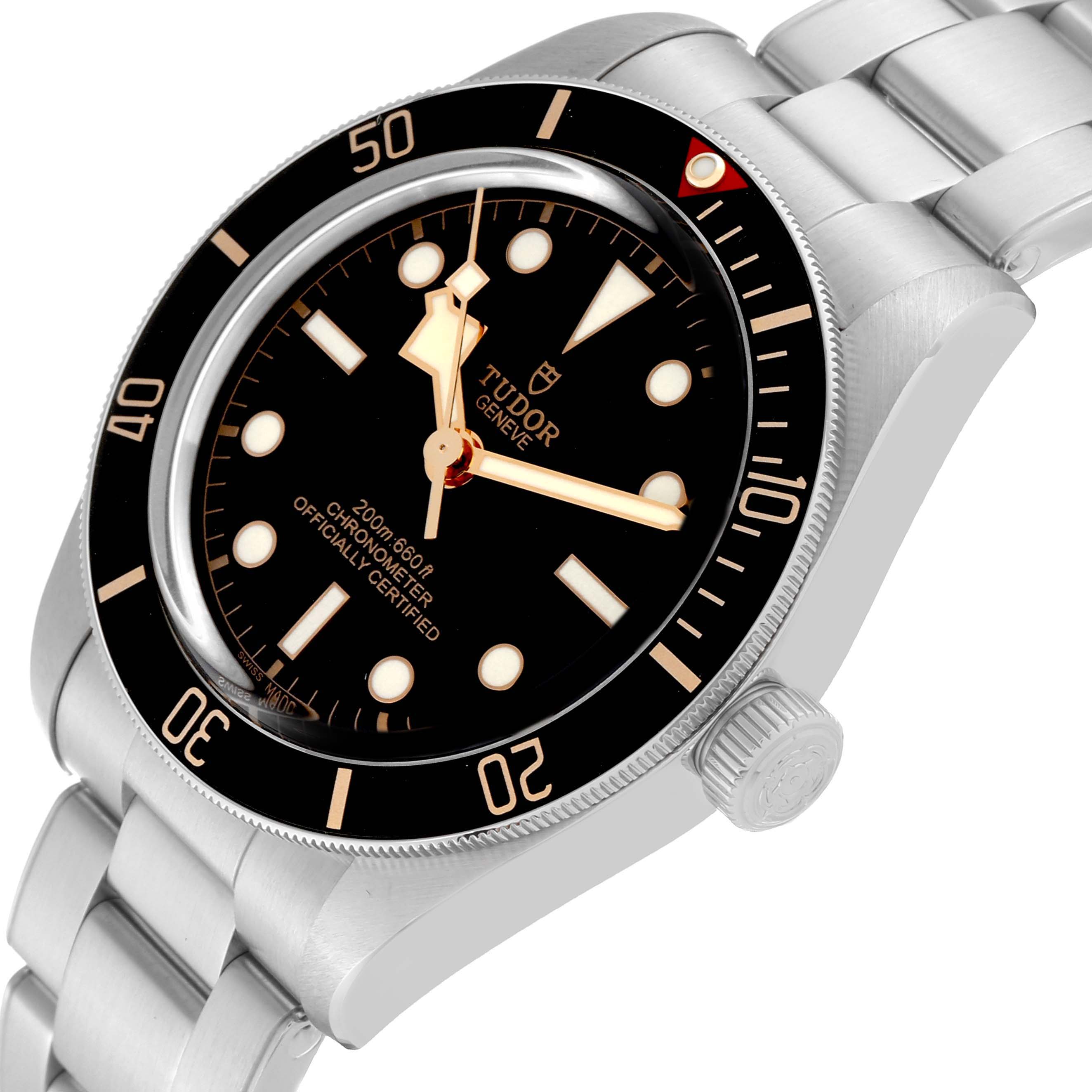 The image shows the Tudor Heritage Black Bay 79030N Men
s Stainless Steel Black Dial 79030N Men
s Stainless Steel Black Dial watch from an overhead angle, highlighting the dial, bezel, crown, and bracelet.