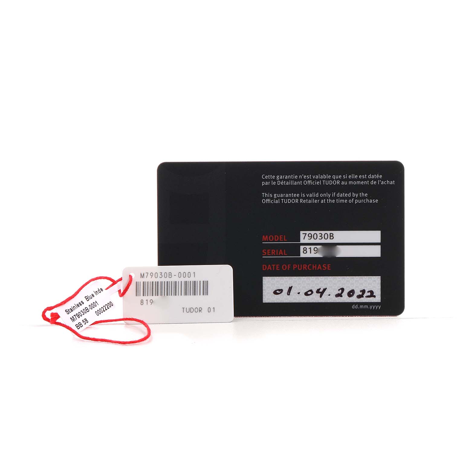 The image shows a warranty card and tag for the Tudor Heritage Black Bay 79030 Men's Stainless Steel Brown Dial model, displaying model, serial number, and purchase date.