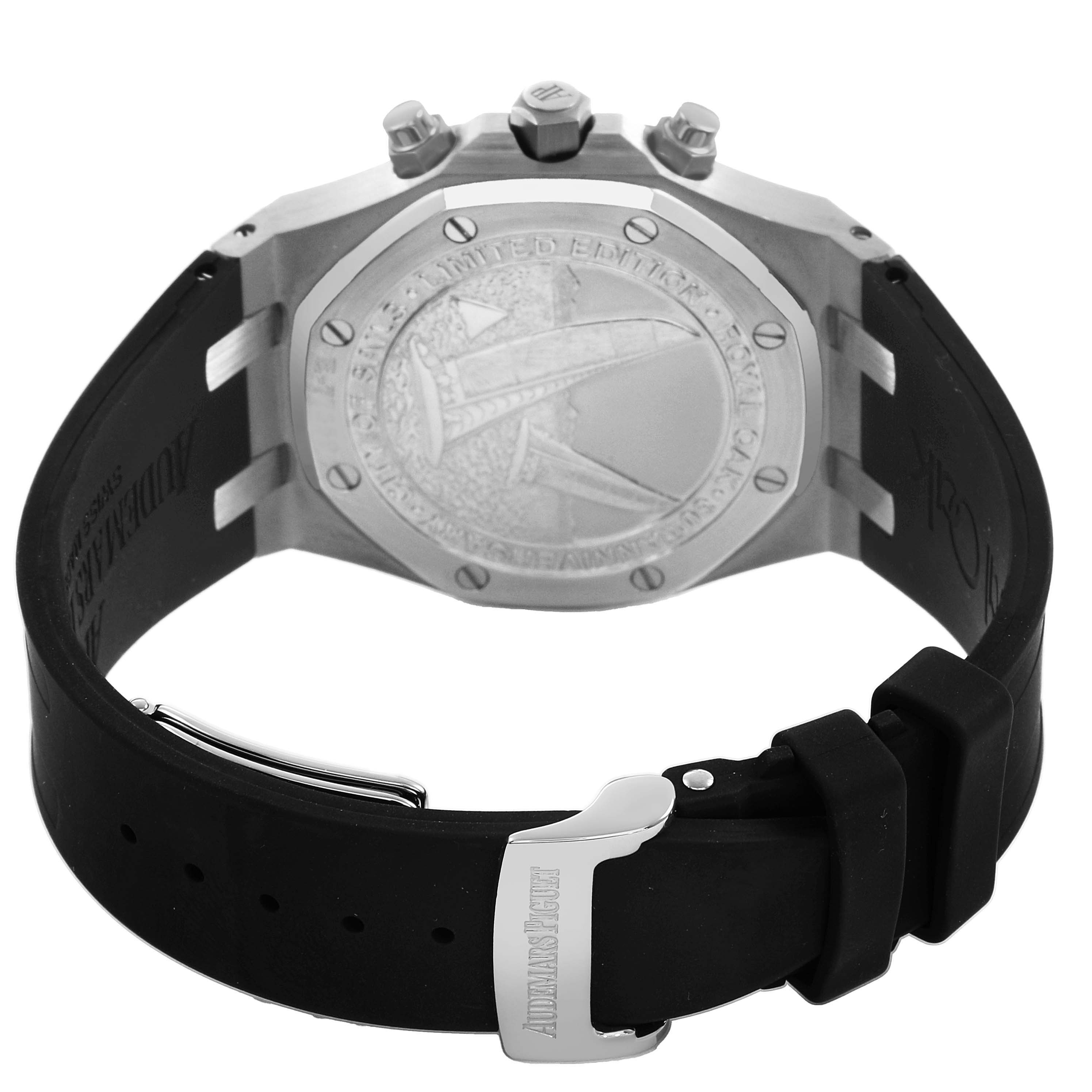 The image shows the back view of a Royal Oak by Audemars Piguet, featuring the case back and rubber strap with a clasp.