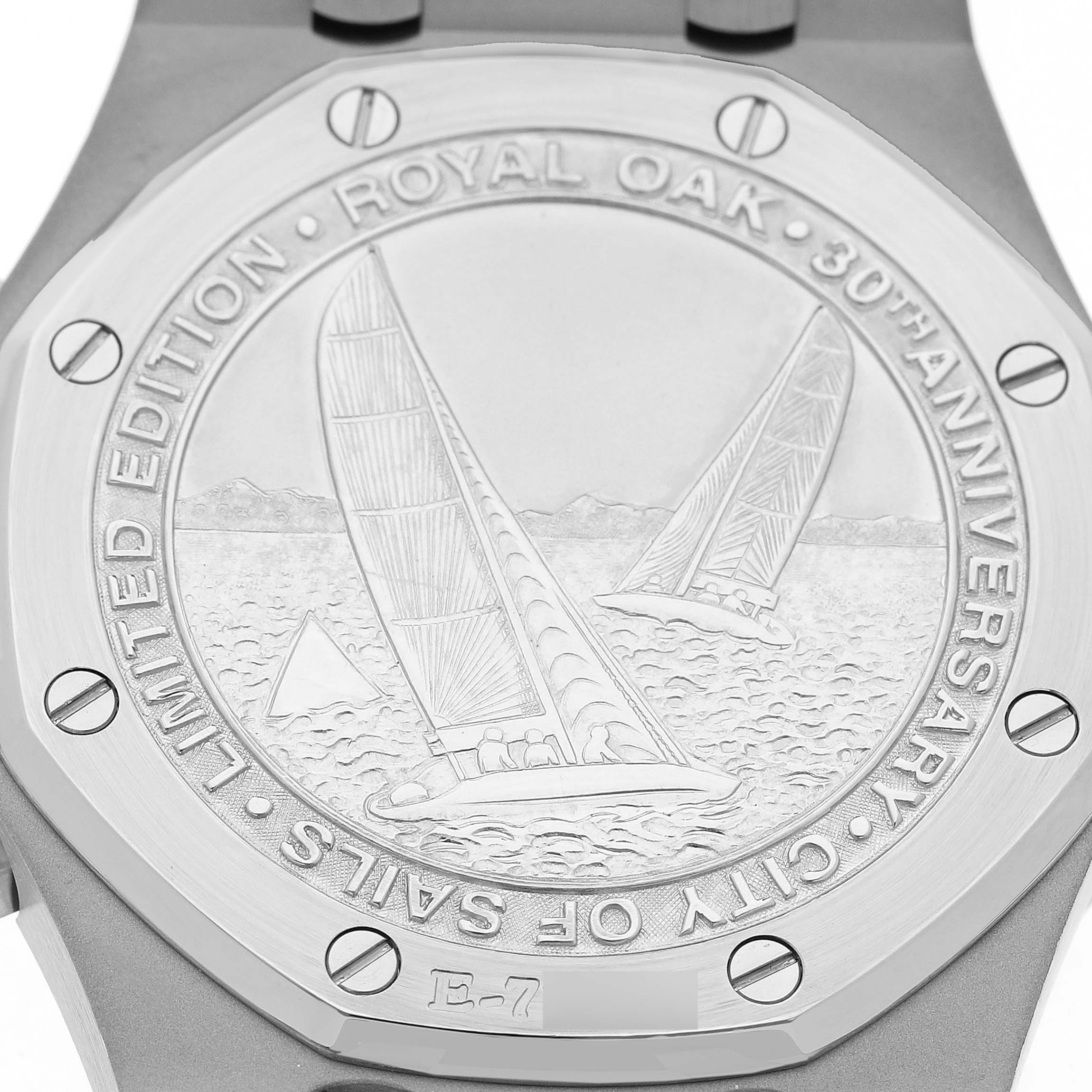 The image shows the case back of an Audemars Piguet Royal Oak 25979ST Men's Stainless Steel Grey Dial, featuring an engraved sailing motif and inscription.