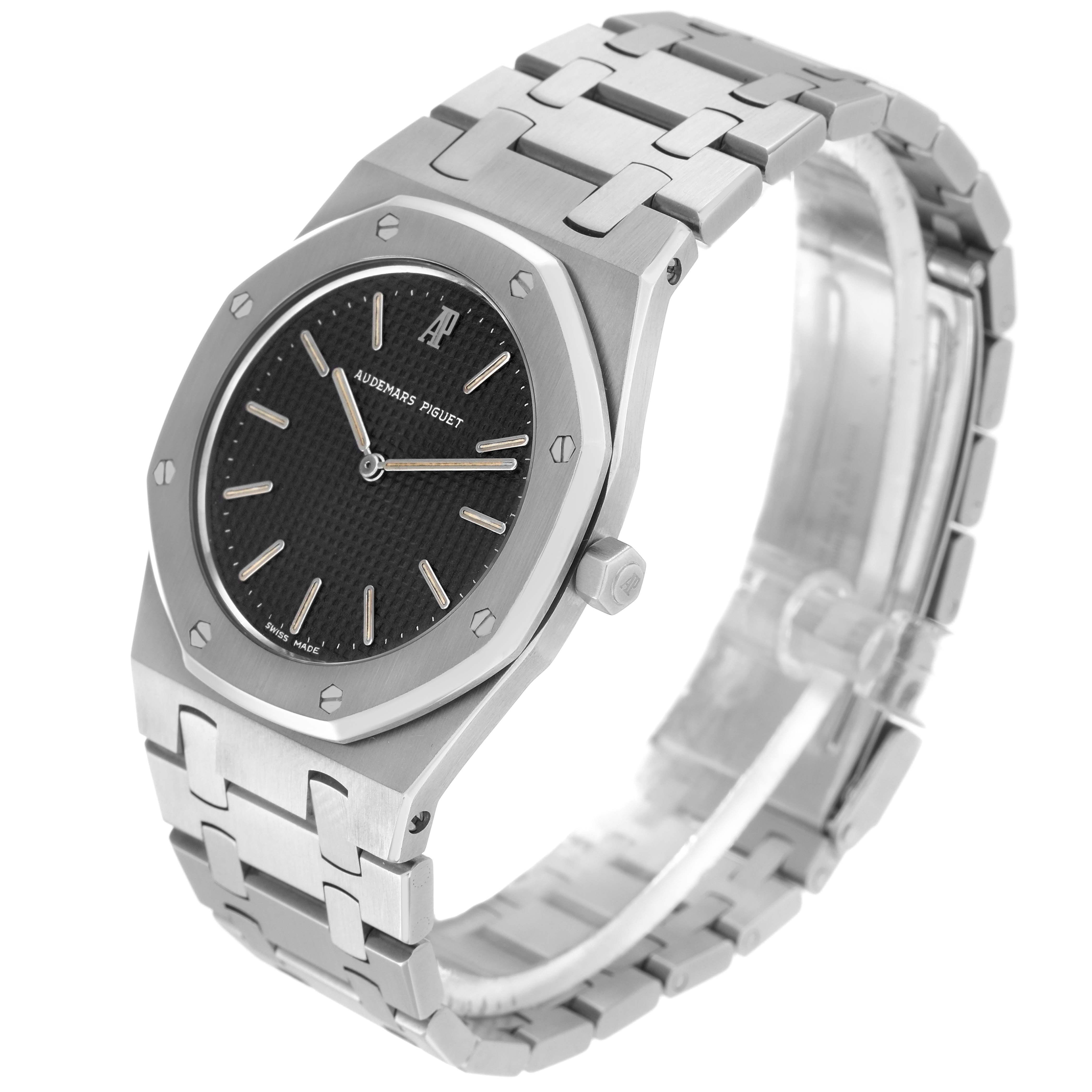 The Audemars Piguet Royal Oak 56303ST.OO.789ST Men
s Stainless Steel Black Dial 56303ST.OO.789ST Men
s Stainless Steel Black Dial watch is shown at a slight angle, showcasing the face, bezel, and bracelet in a side view.