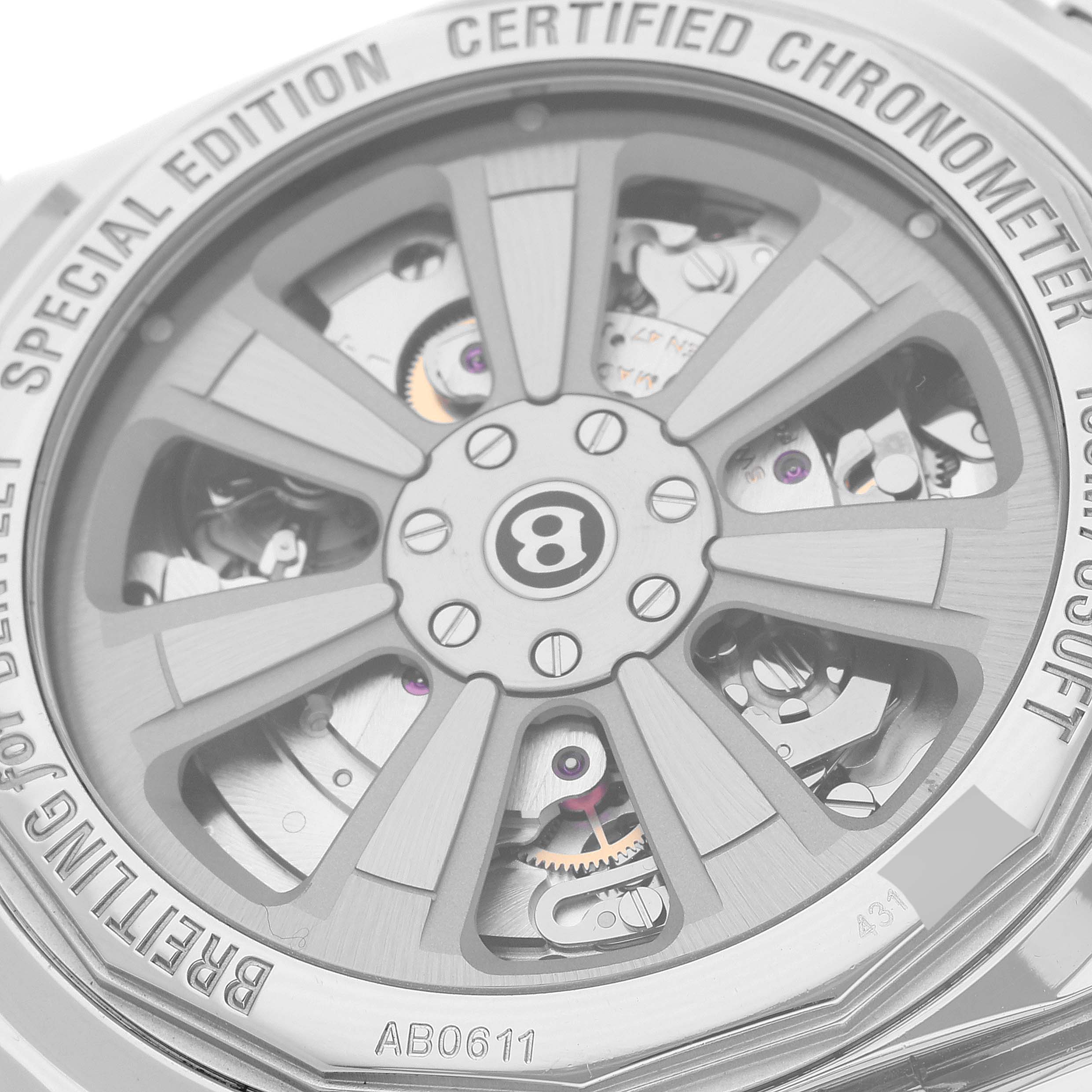 The image shows the case back of a Breitling Bentley AB0611 Men's Stainless Steel Silver Dial AB0611 Men's Stainless Steel Silver Dial watch, featuring its intricate inner mechanism and branding engravings.