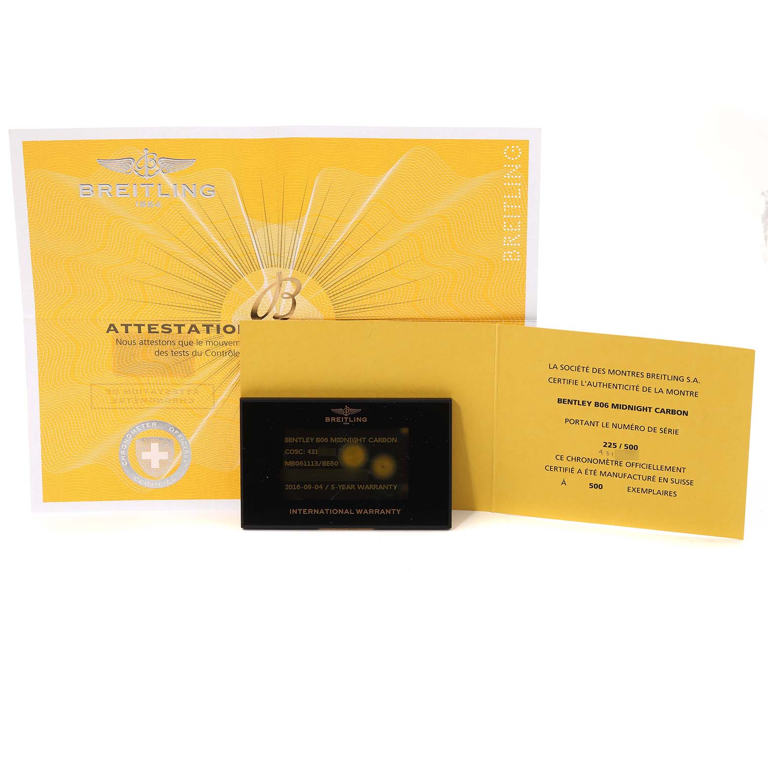 The image shows warranty documents and certification for the Bentley model by Breitling, viewed from above.