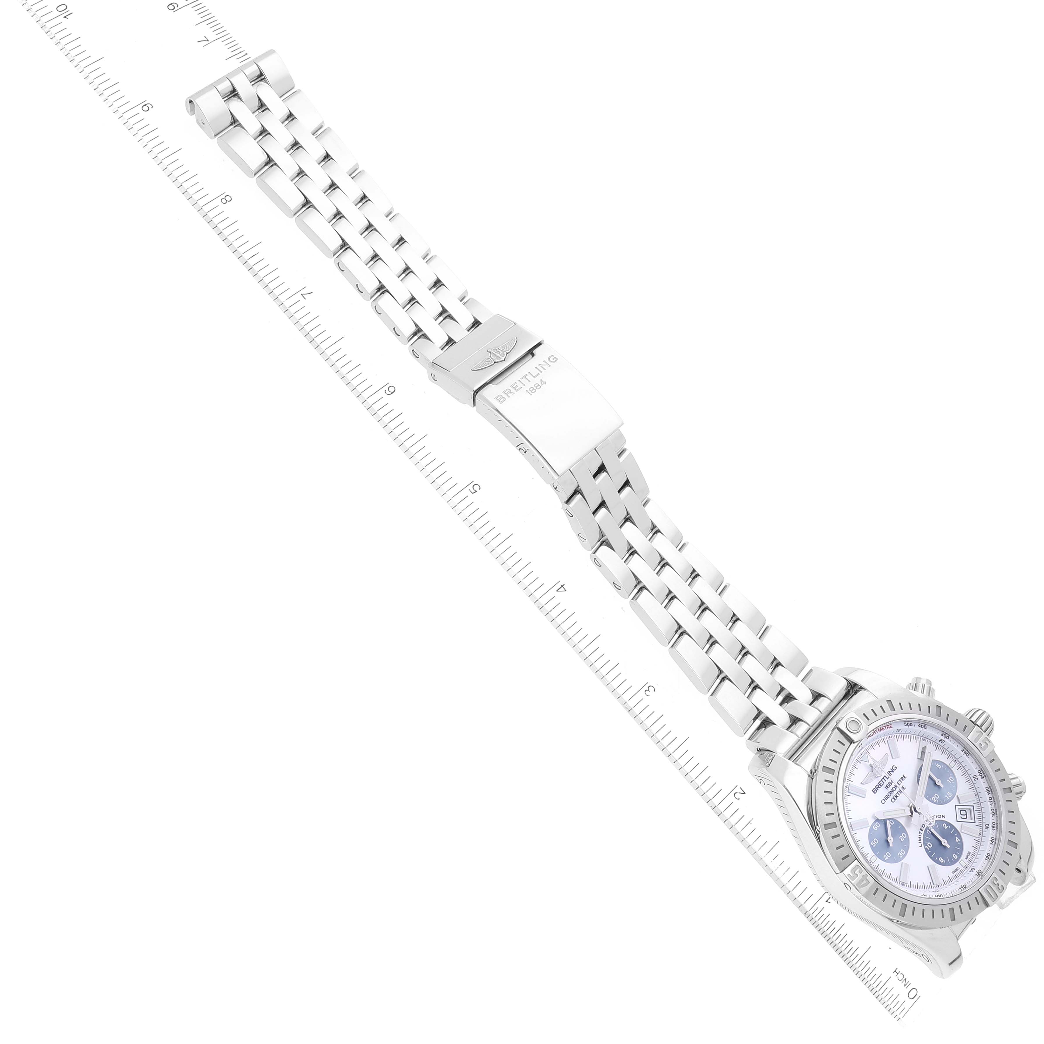 The image shows a top-down view of a Breitling Chronomat AB0115 Men's Stainless Steel Mother of Pearl Dial AB0115 Men's Stainless Steel Mother of Pearl Dial watch with its dial, bracelet, and clasp visible, next to a ruler for scale.