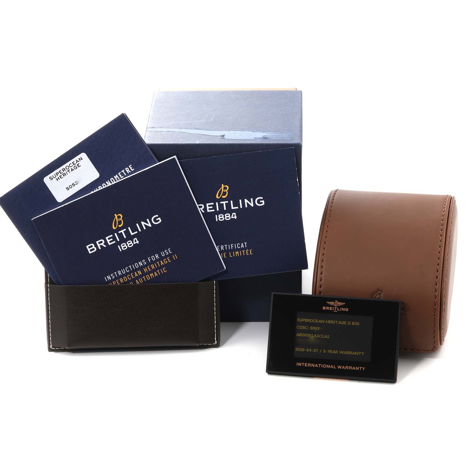 The image shows a Breitling Superocean AB2030 Men's Stainless Steel Blue Dial AB2030 Men's Stainless Steel Blue Dial watch box, manuals, warranty card, and a brown leather carrying case, viewed from the front.
