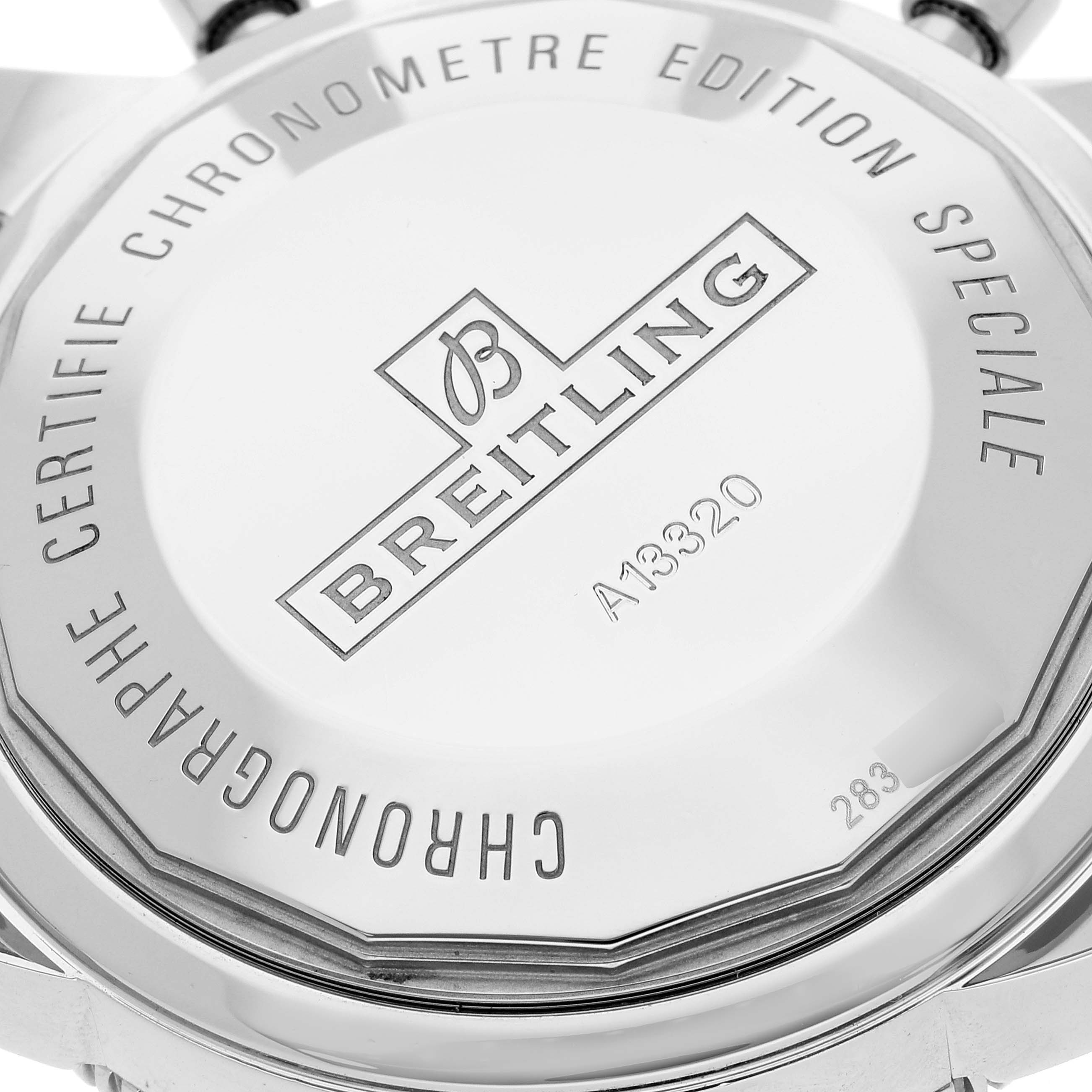 This image shows the back of the Breitling Superocean A13320 Men's Stainless Steel Black Dial A13320 Men's Stainless Steel Black Dial watch, highlighting the engraved brand name, model number, and certification details.