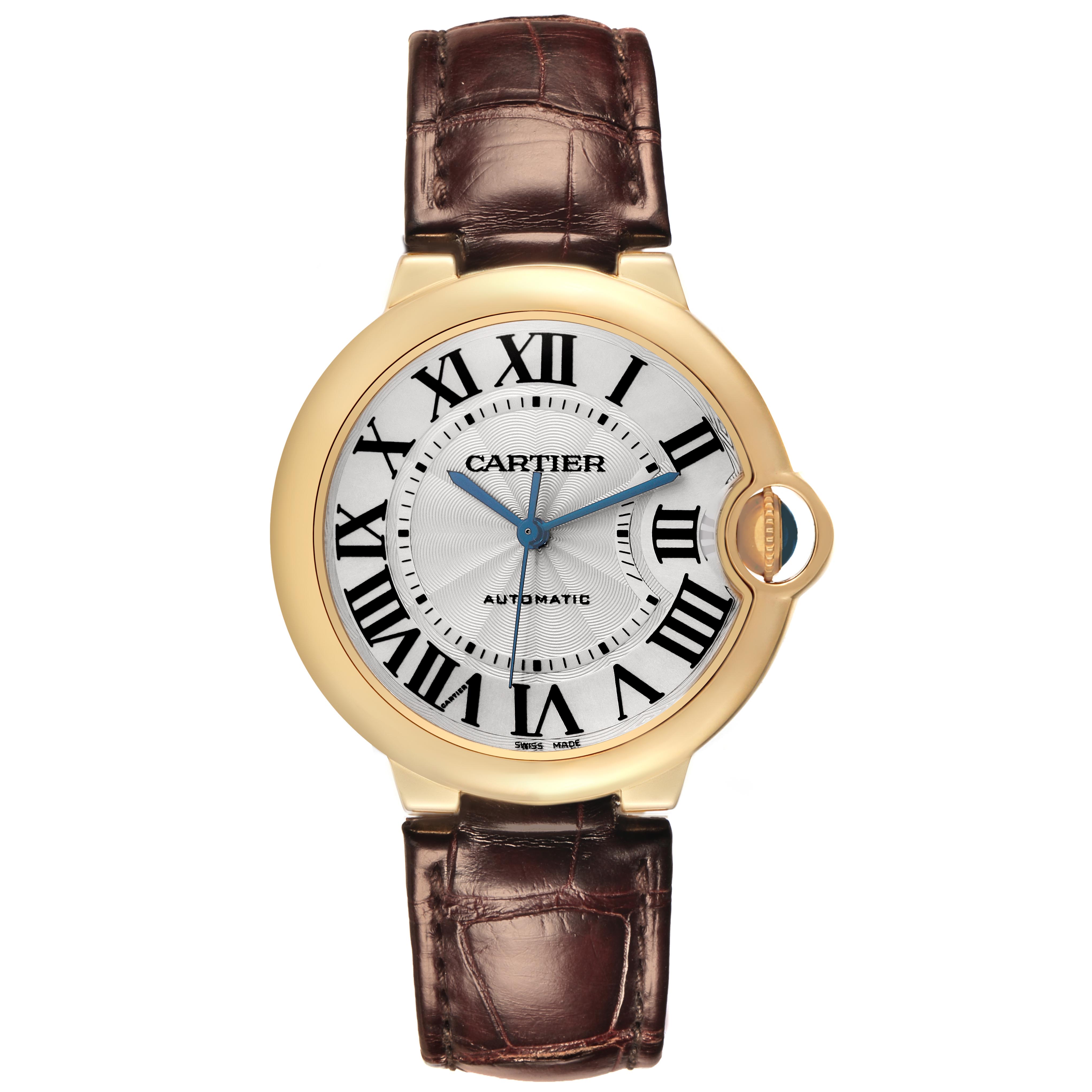 The Cartier Ballon Bleu W6900356 Men
s Yellow Gold Silver Dial W6900356 Men
s Yellow Gold Silver Dial watch is shown from the front, displaying its face, Roman numerals, and leather strap.