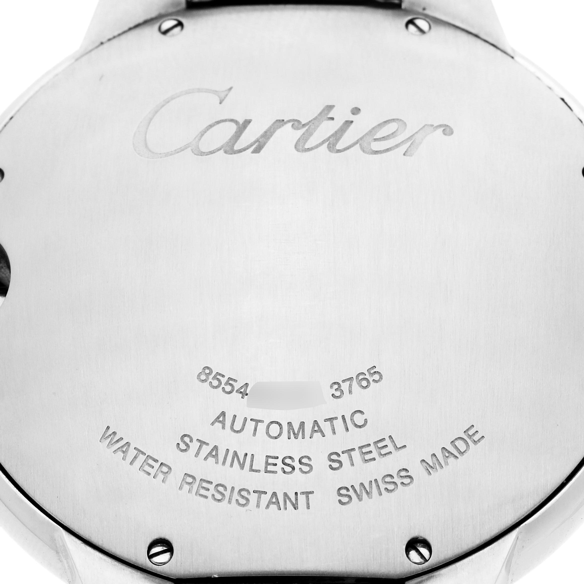 The image shows the case back of a Cartier Ballon Bleu W6920042 Men
s Stainless Steel Black Dial W6920042 Men
s Stainless Steel Black Dial watch, displaying engraved details and screws.