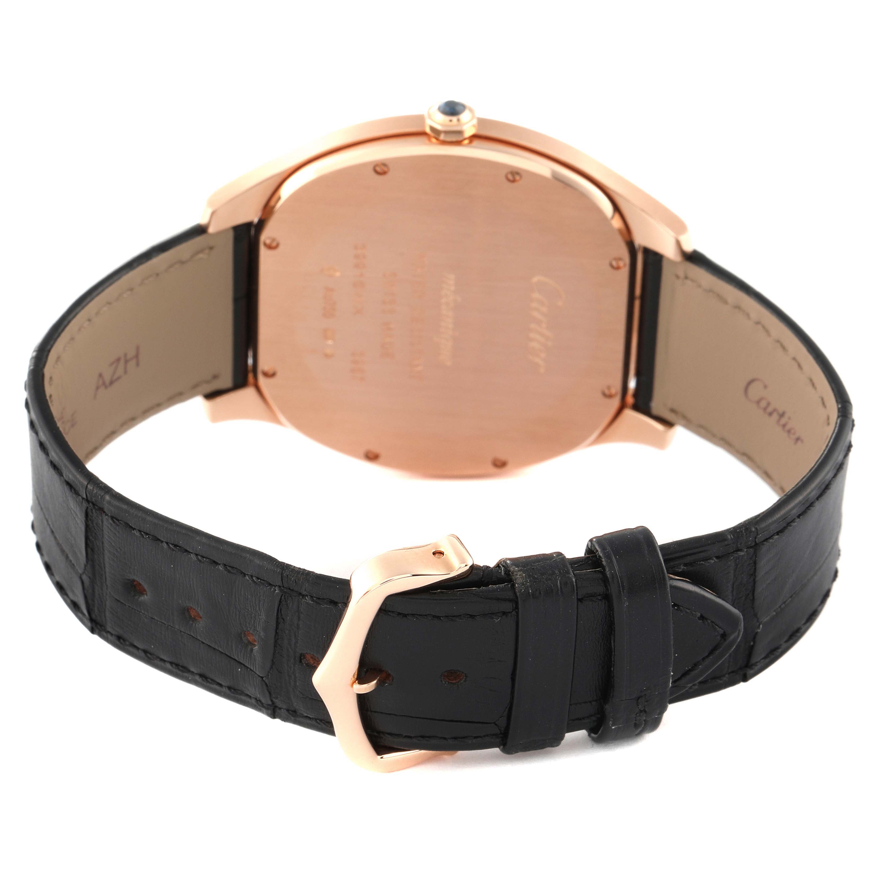 The image shows the back case, crown, and leather strap of a Drive de Cartier watch by Cartier, viewed from the rear.