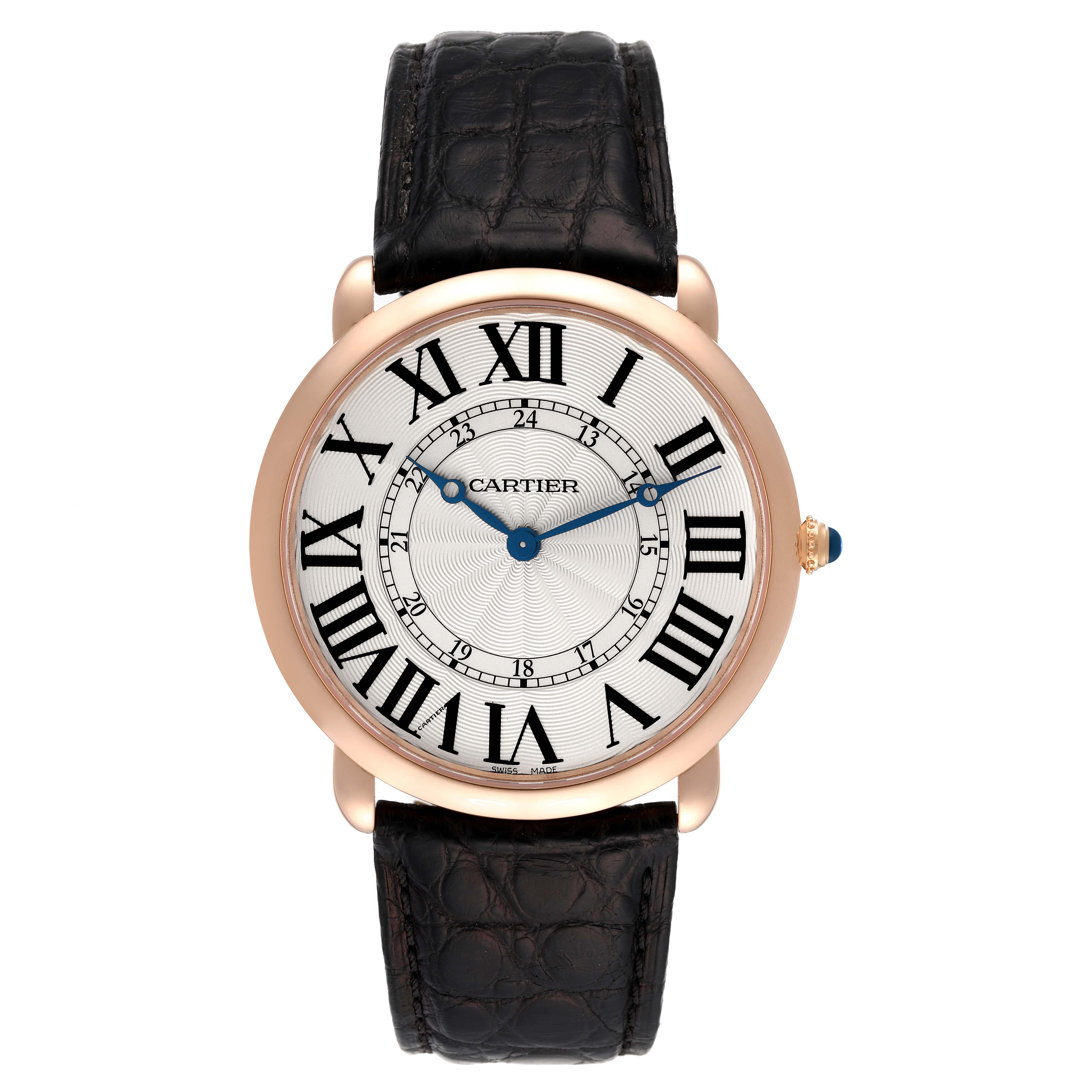 The Cartier Ronde W6801004 Men
s Rose Gold Silver Dial W6801004 Men
s Rose Gold Silver Dial watch is shown from a top-down angle, displaying the black leather strap, white dial, and Roman numerals.